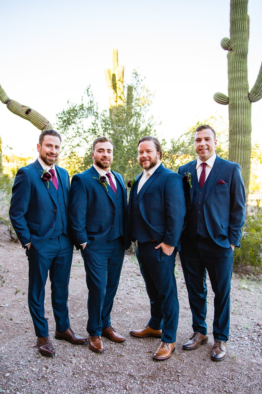 Groom and groomsmen together at a Arizona Heritage Center at Papago Park wedding by Arizona wedding photographer PMA Photography.