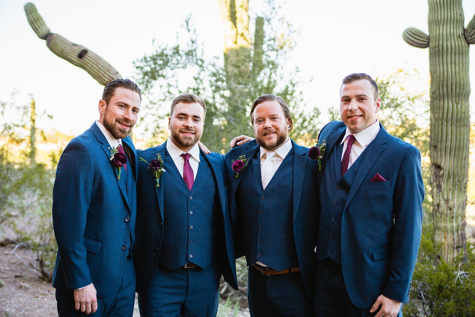 Groom and groomsmen together at a Arizona Heritage Center at Papago Park wedding by Arizona wedding photographer PMA Photography.