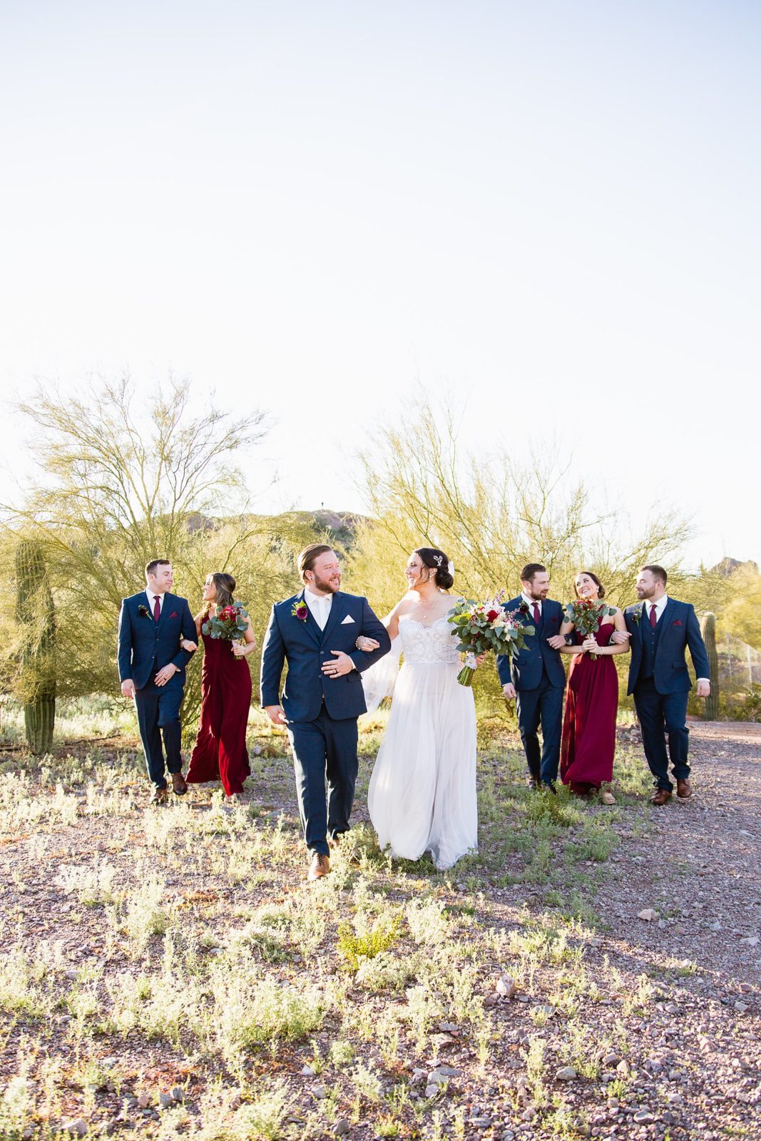 Bridal party laughing together at Arizona Heritage Center at Papago Park wedding by Tempe wedding photographer PMA Photography.