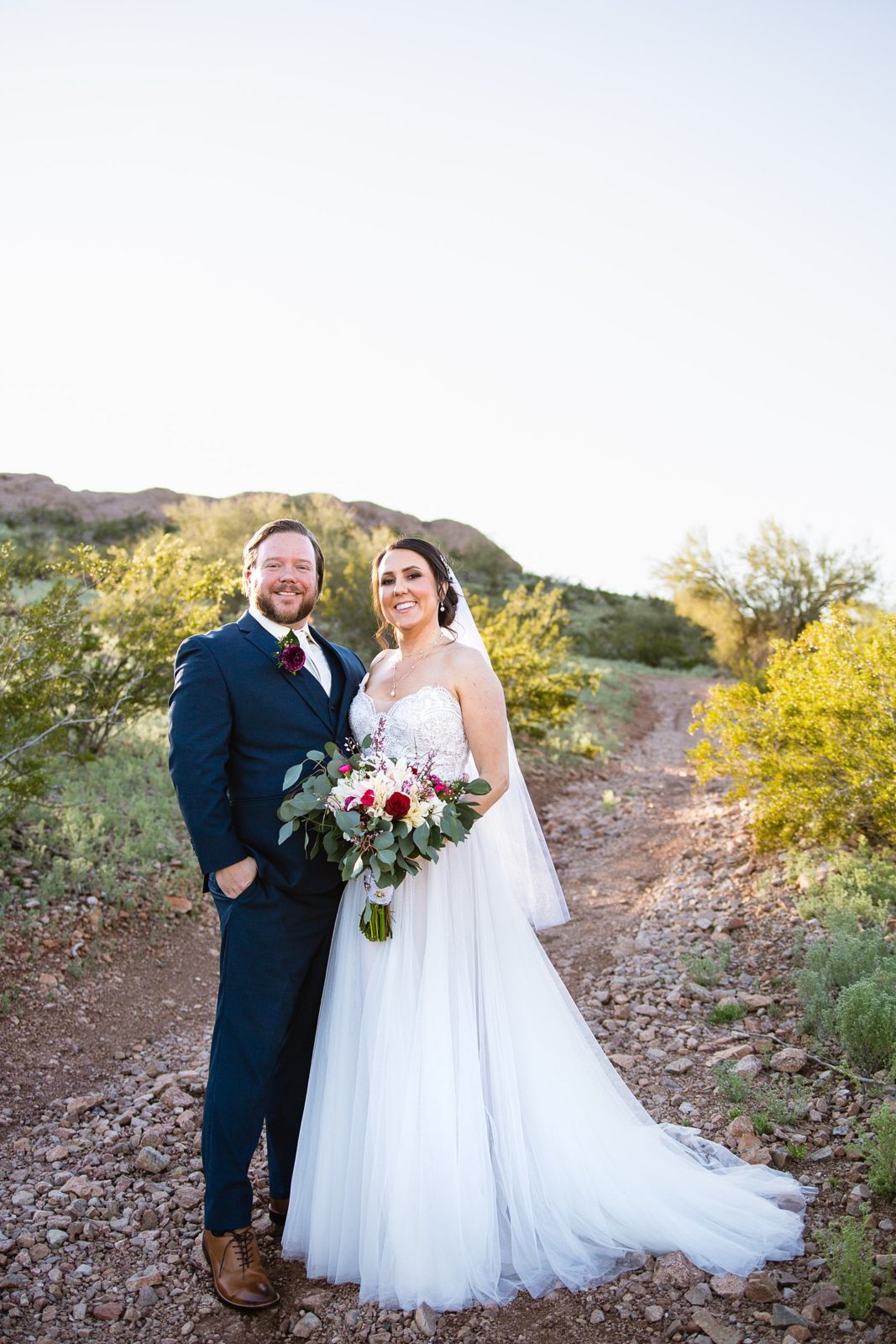 Bride and Groom pose for their Arizona Heritage Center at Papago Park wedding by Tempe wedding photographer PMA Photography.