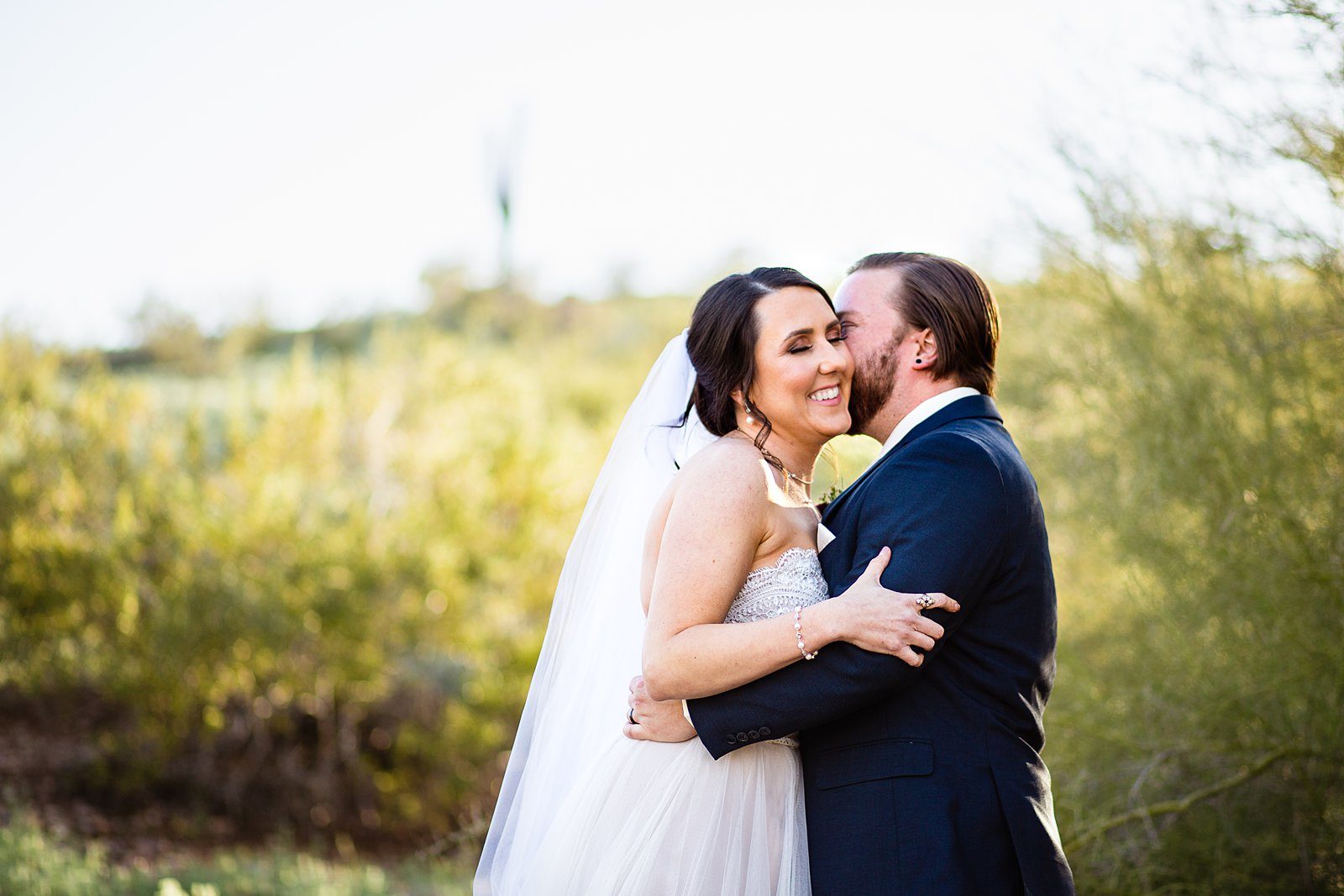 Bride and Groom share an intimate moment at their Arizona Heritage Center at Papago Park wedding by Arizona wedding photographer PMA Photography.