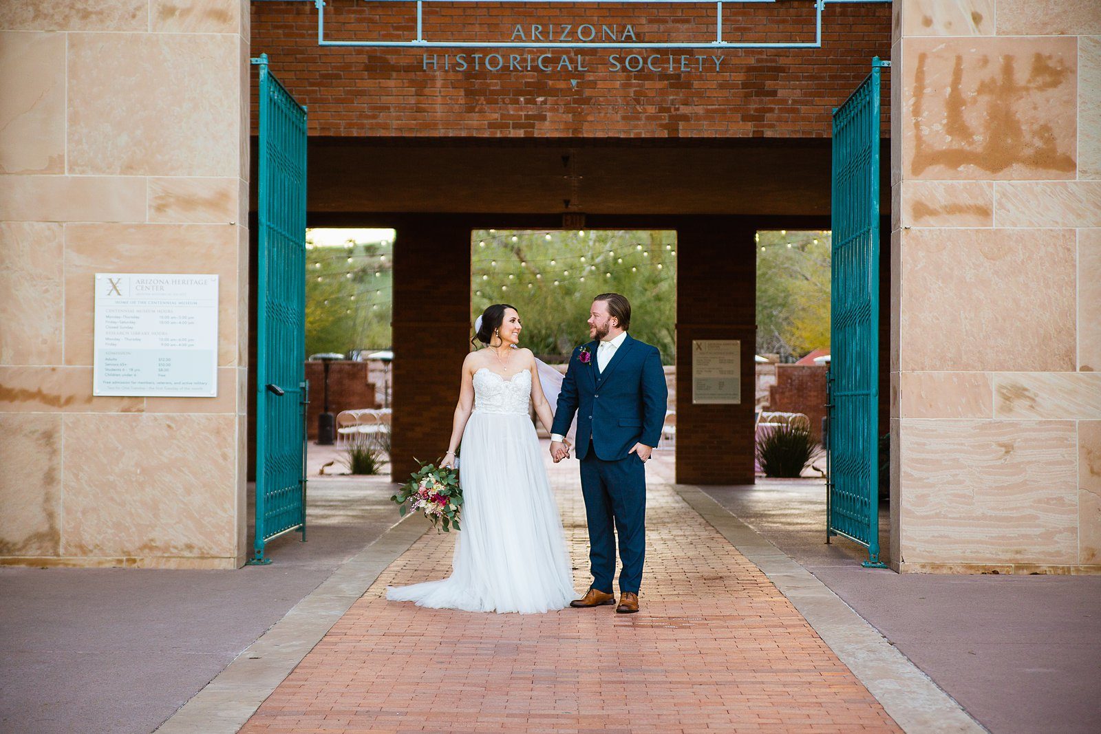 Bride and Groom pose for their Arizona Heritage Center at Papago Park wedding by Tempe wedding photographer PMA Photography.