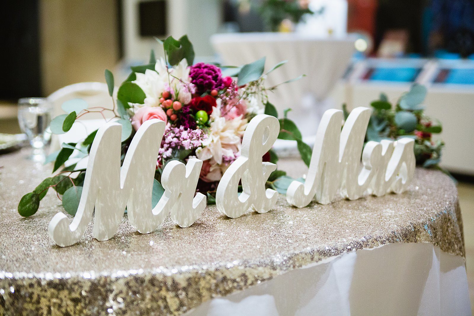 Mr. & Mrs decoration on a sweetheart table by PMA Photography.