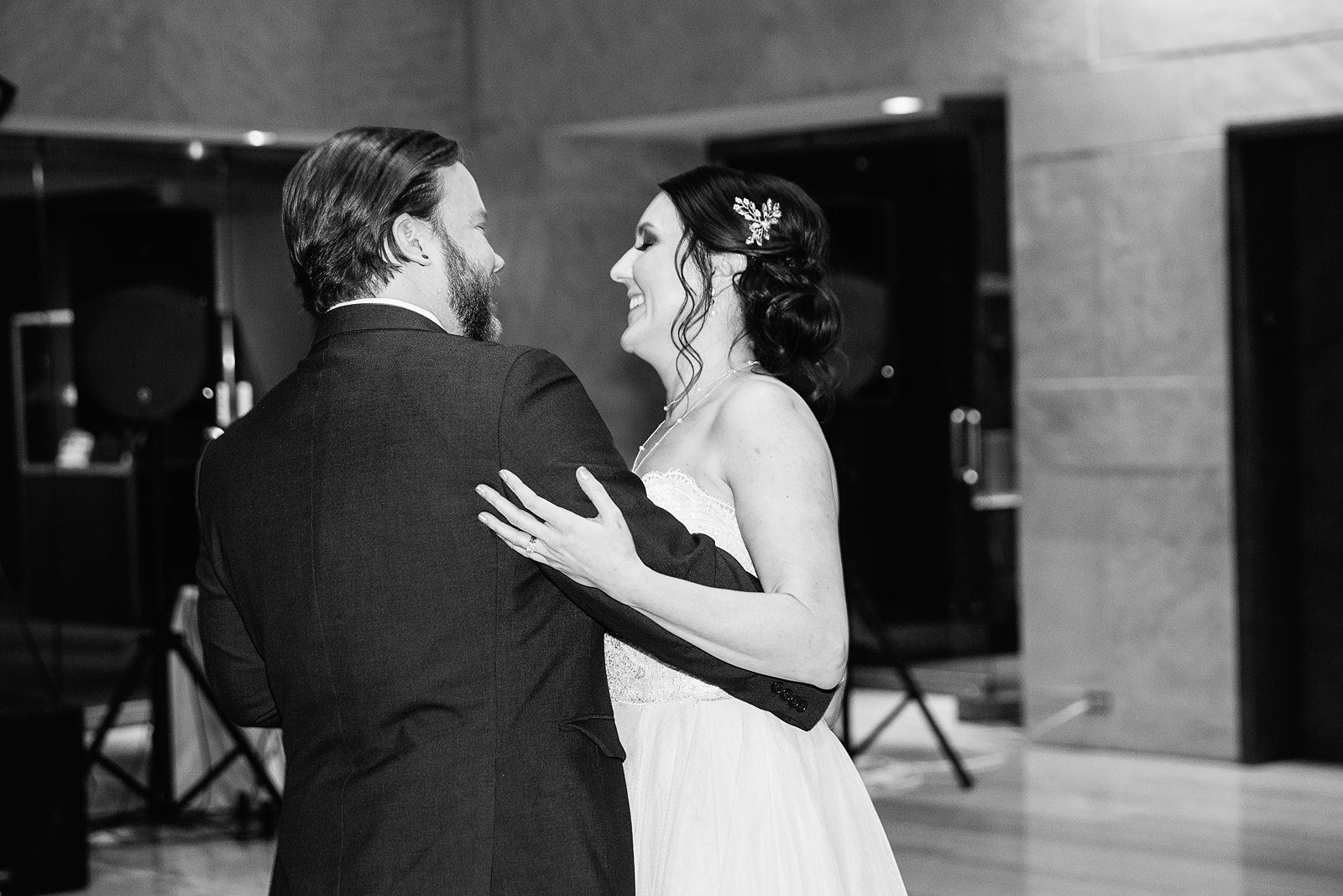 Bride and Groom sharing first dance at their Arizona Heritage Center at Papago Park wedding reception by Arizona wedding photographer PMA Photography.