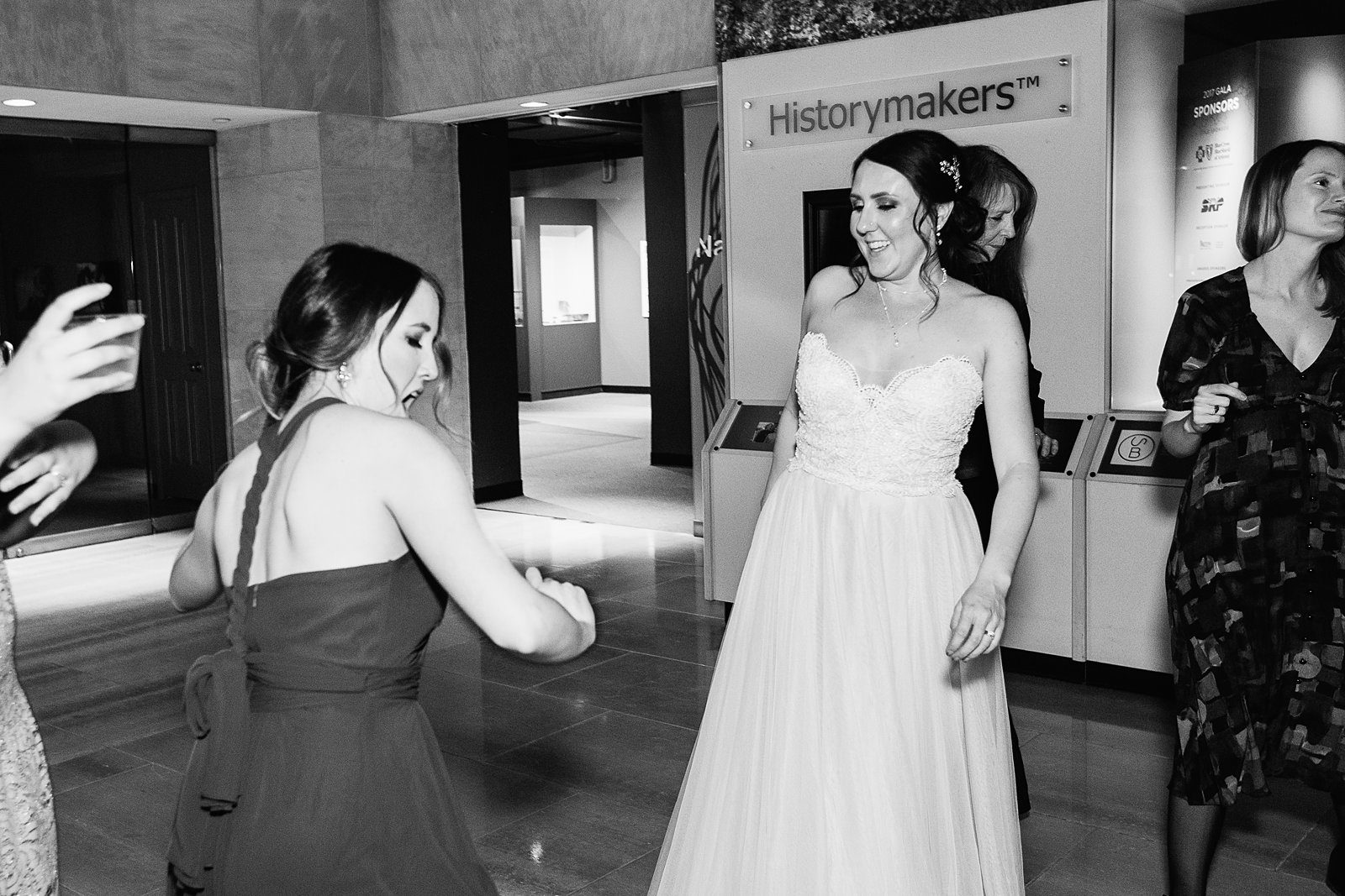 Bride dancing with guests at Arizona Heritage Center at Papago Park wedding reception by Tempe wedding photographer PMA Photography