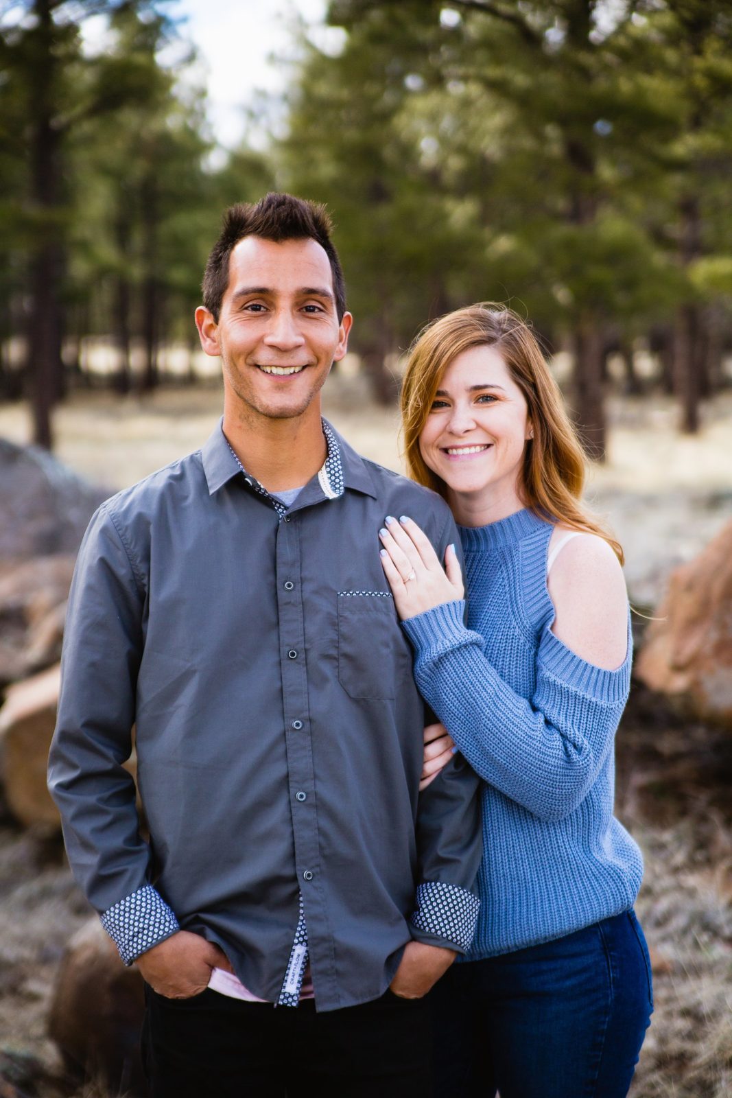 Couple pose during their Flagstaff engagement session by Arizona wedding photographer PMA Photography.
