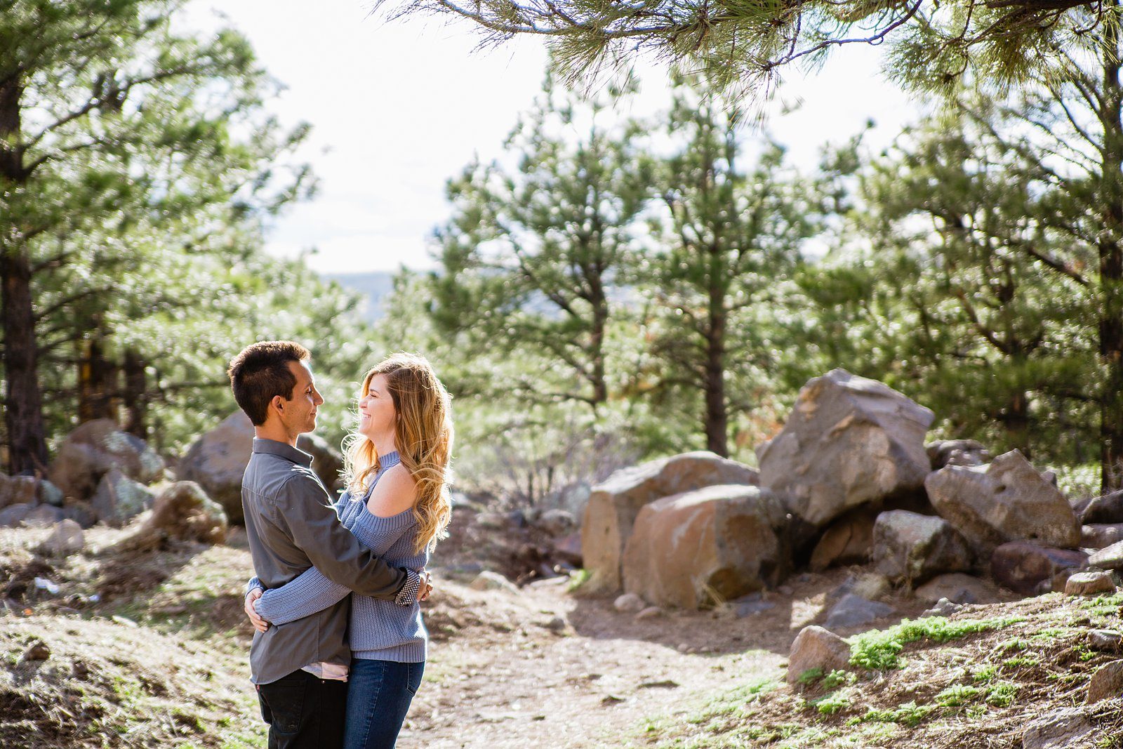 Couple pose for their Buffalo Park engagement session by Flagstaff wedding photographer PMA Photography.