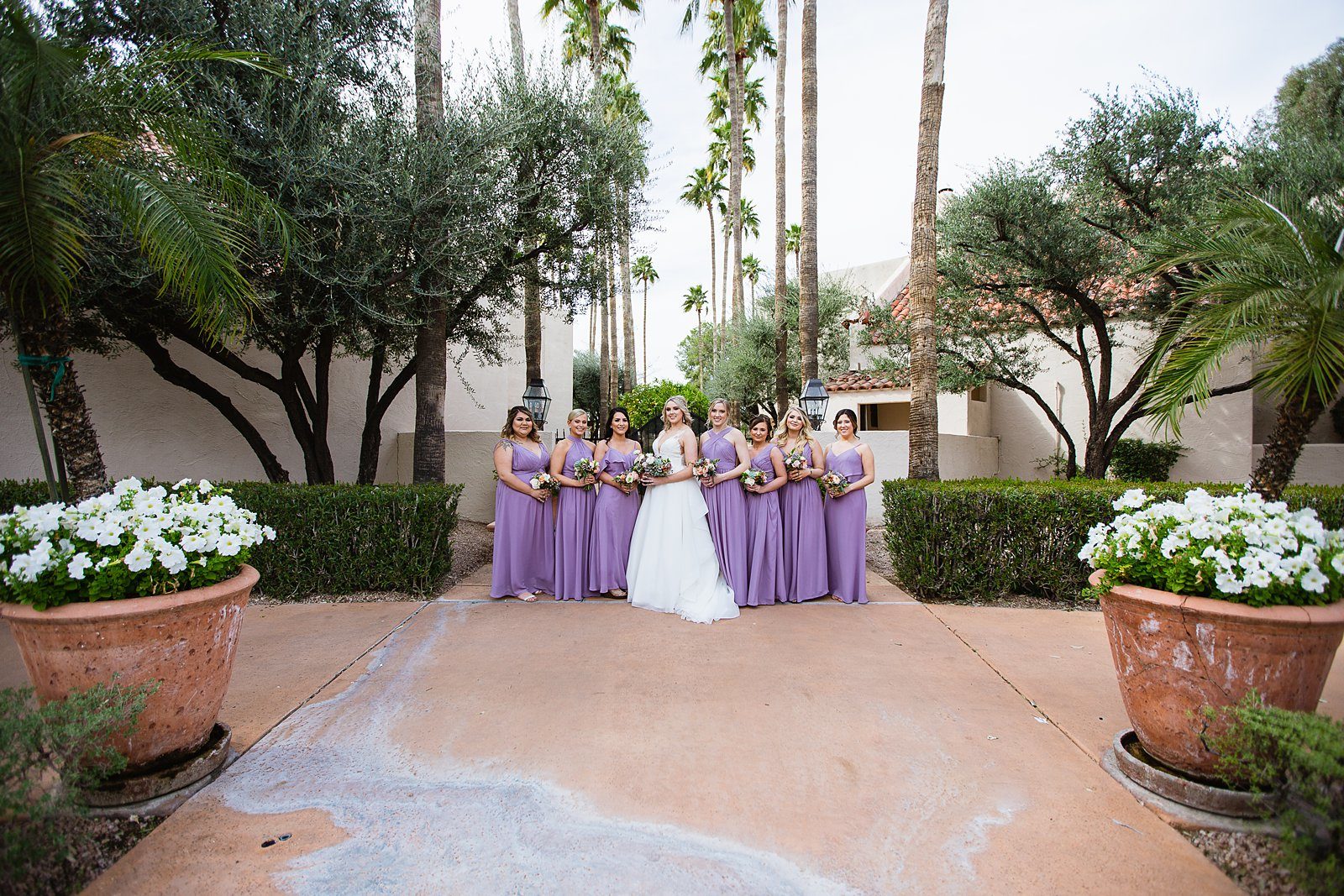 Bride and bridesmaids together at a The Scottsdale Resort at McCormick Ranch wedding by Arizona wedding photographer PMA Photography.