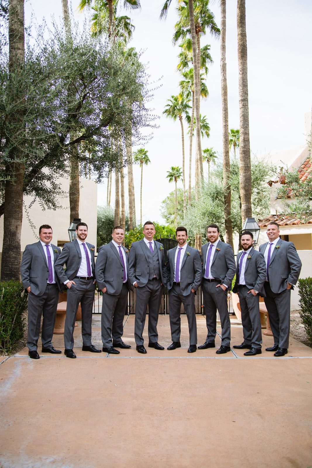 Groom and groomsmen together at a The Scottsdale Resort at McCormick Ranch wedding by Arizona wedding photographer PMA Photography.