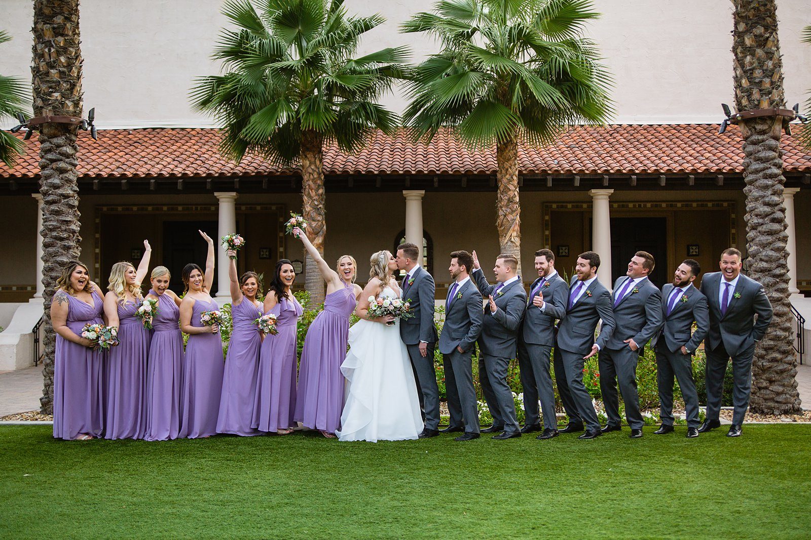 Bridal party having fun together at The Scottsdale Resort at McCormick Ranch weding by Arizona wedding photographer PMA Photography.