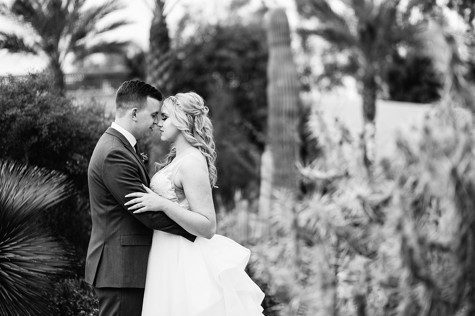 Bride and Groom share an intimate moment at their The Scottsdale Resort at McCormick Ranch wedding by Arizona wedding photographer PMA Photography.