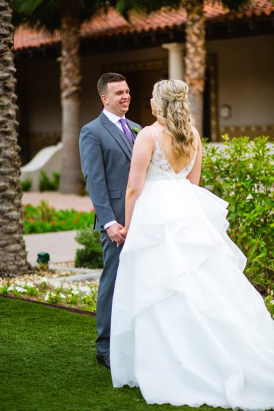 Bride and Groom laughing together during their The Scottsdale Resort at McCormick Ranch wedding by Arizona wedding photographer PMA Photography.