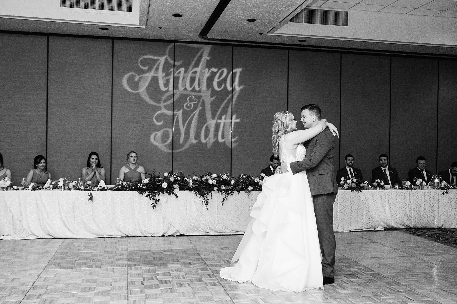 Bride and Groom sharing first dance at their The Scottsdale Resort at McCormick Ranch wedding reception by Arizona wedding photographer PMA Photography.