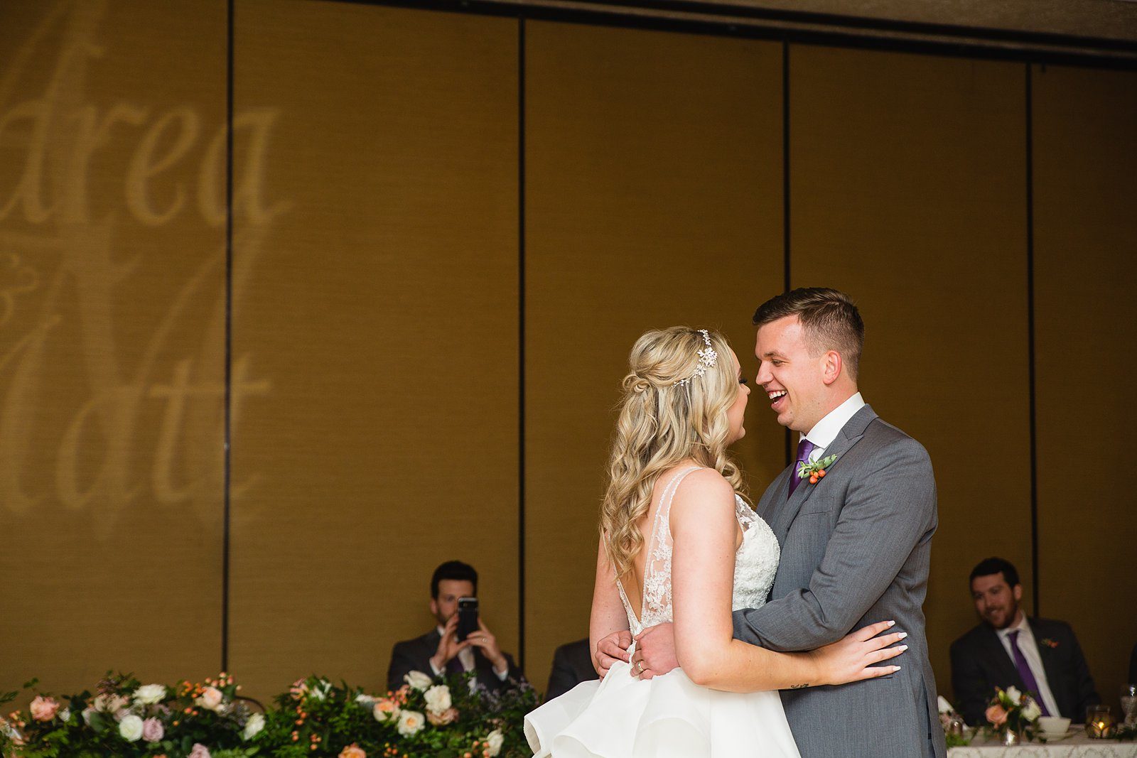 Bride and Groom sharing first dance at their The Scottsdale Resort at McCormick Ranch wedding reception by Arizona wedding photographer PMA Photography.