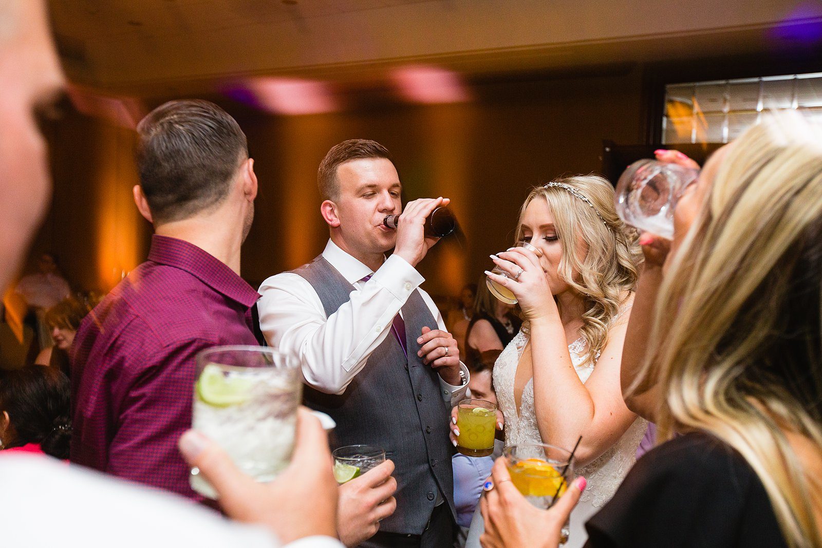 Bride and groom share a toast with their wedding guests by PMA Photography.