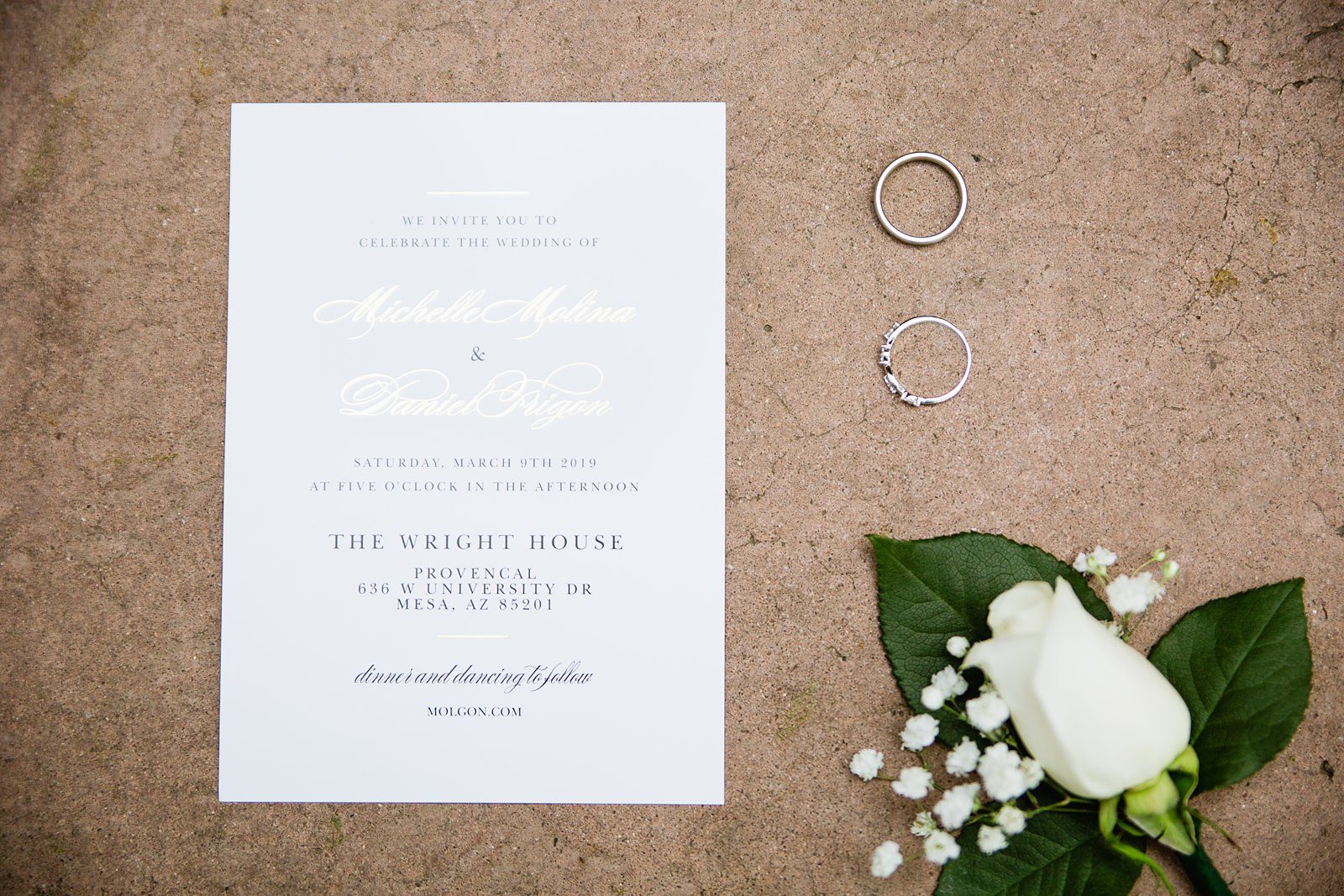 Simple classic wedding invitations with classic rose boutonniere and wedding rings by PMA Photography.