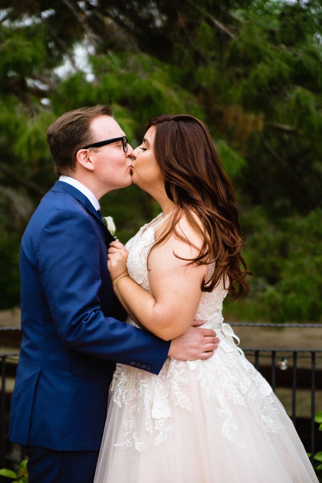 Bride and Groom share a kiss during their The Wright House Provencal wedding by Arizona wedding photographer PMA Photography.