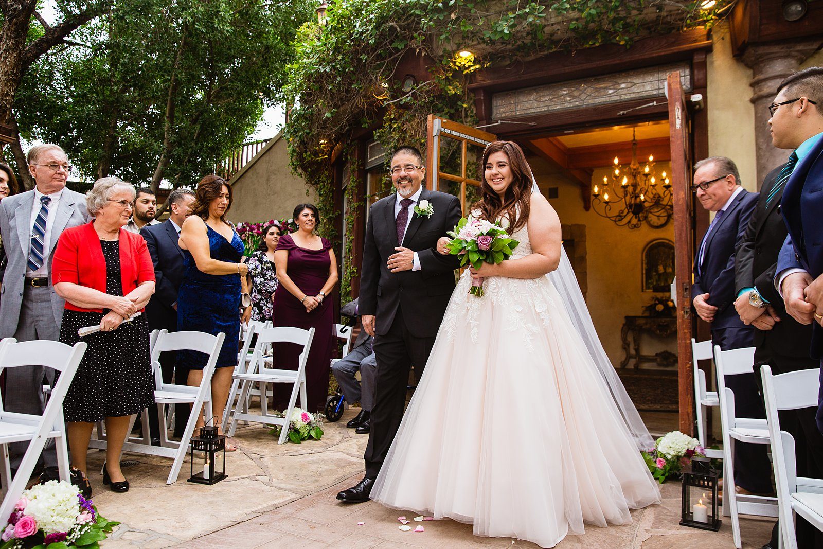 Bride walking down aisle during The Wright House Provencal wedding ceremony by Arizona wedding photographer PMA Photography.
