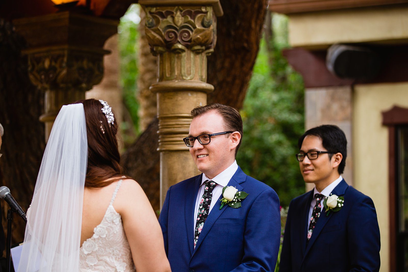 Groom looking at his bride during their wedding ceremony at The Wright House Provencal by Mesa wedding photographer PMA Photography.
