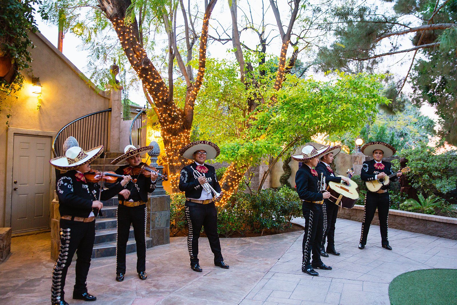 Mariachi band playing for guests during cocktail hour at a Wright House Provencal wedding by Arizona wedding photographer PMA Photography.