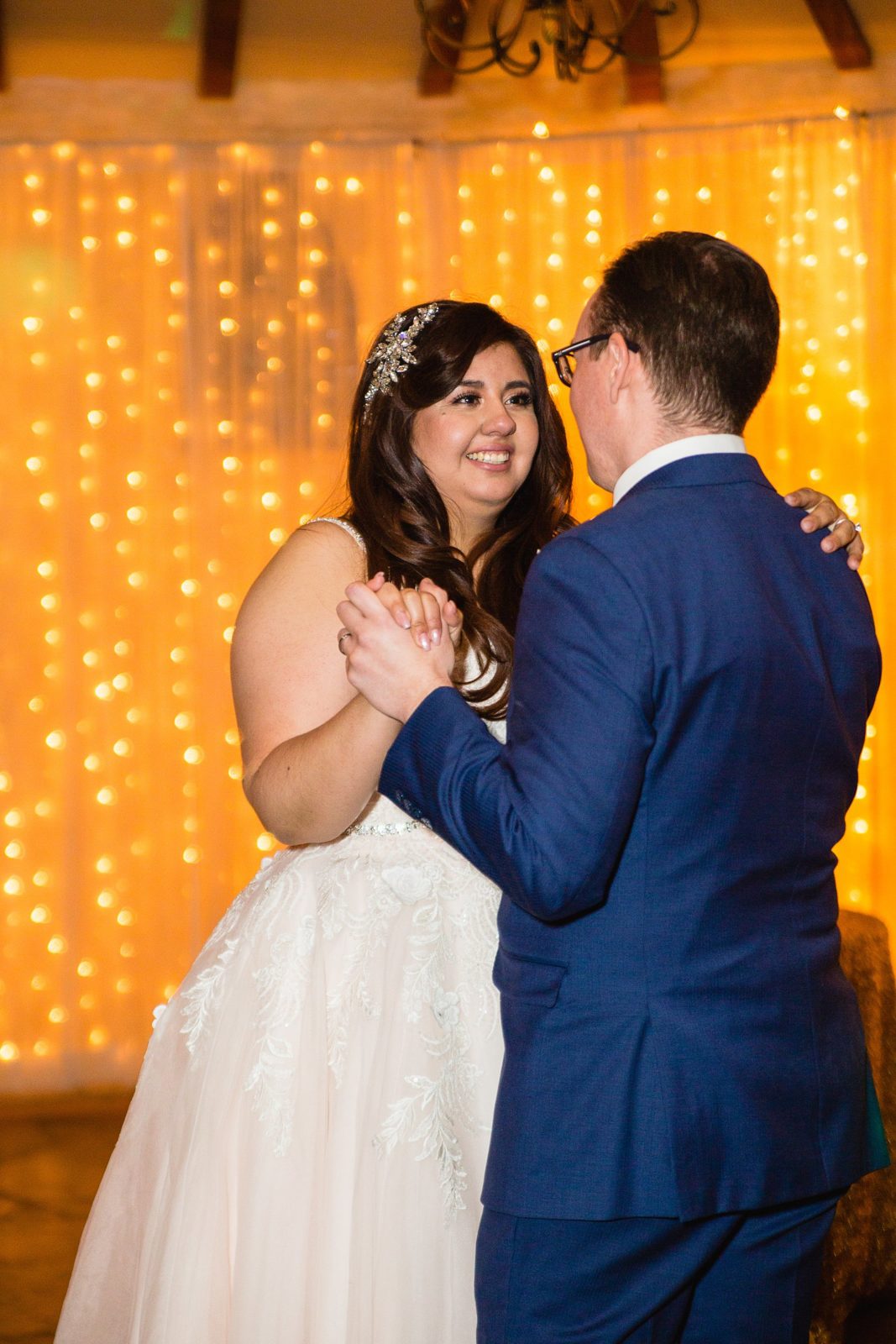 Bride and Groom sharing first dance at their Wright House Provencal wedding reception by Arizona wedding photographer PMA Photography.