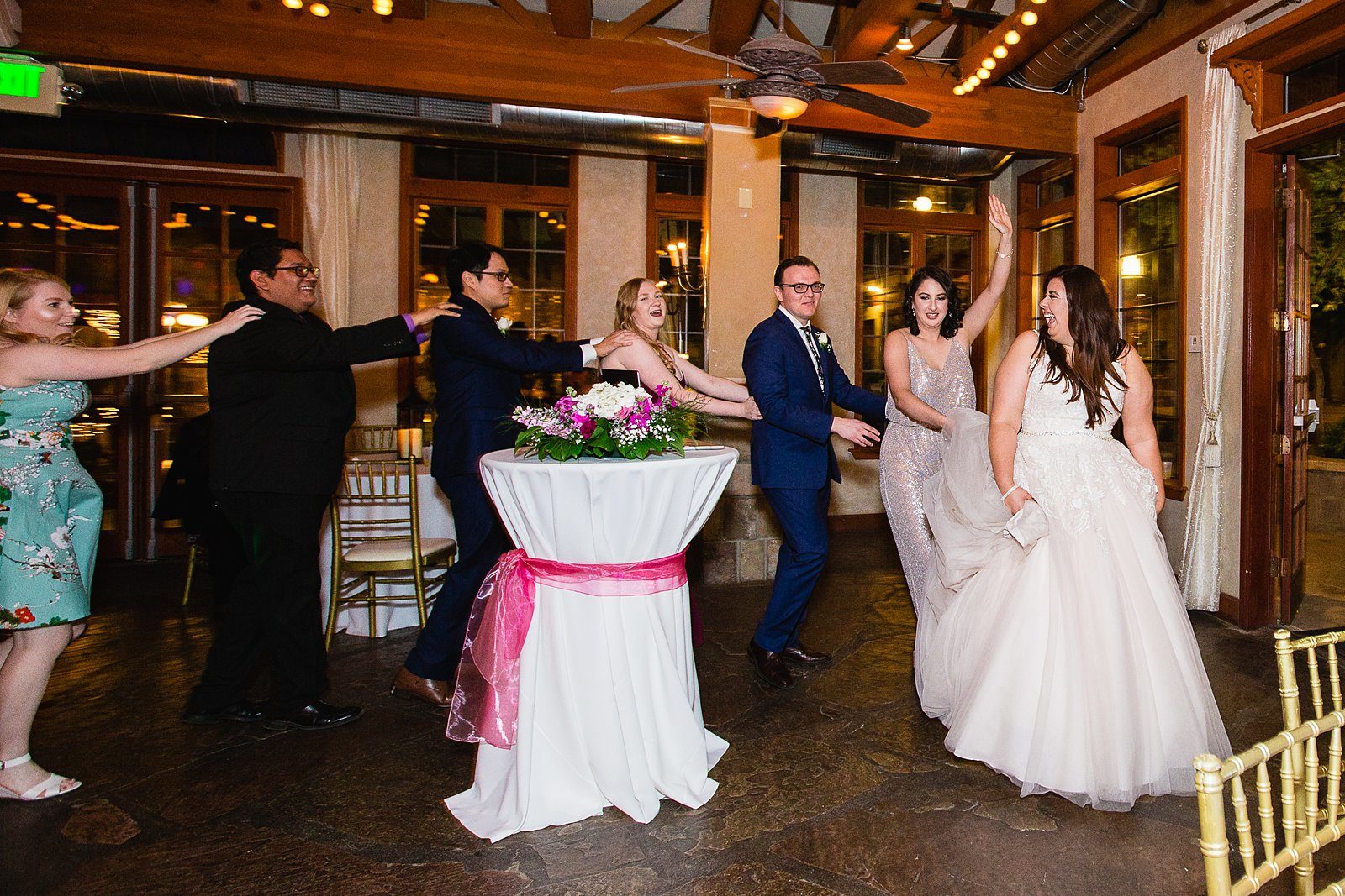 Bride and Groom dancing with guests at their Wright House Provencal wedding reception by Arizona wedding photographer PMA Photography