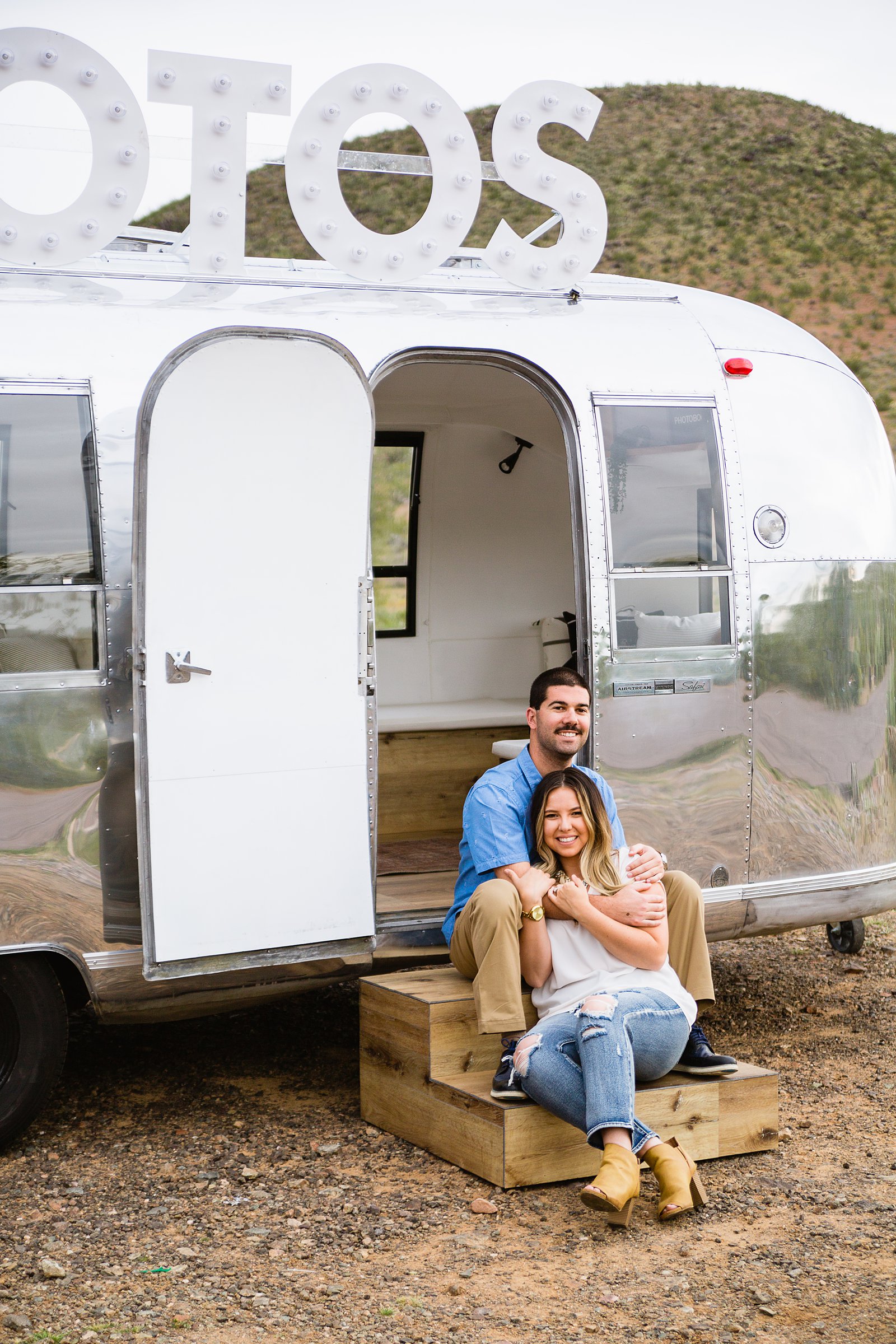Couple pose for their Air Stream engagement session by Phoenix wedding photographer PMA Photography.