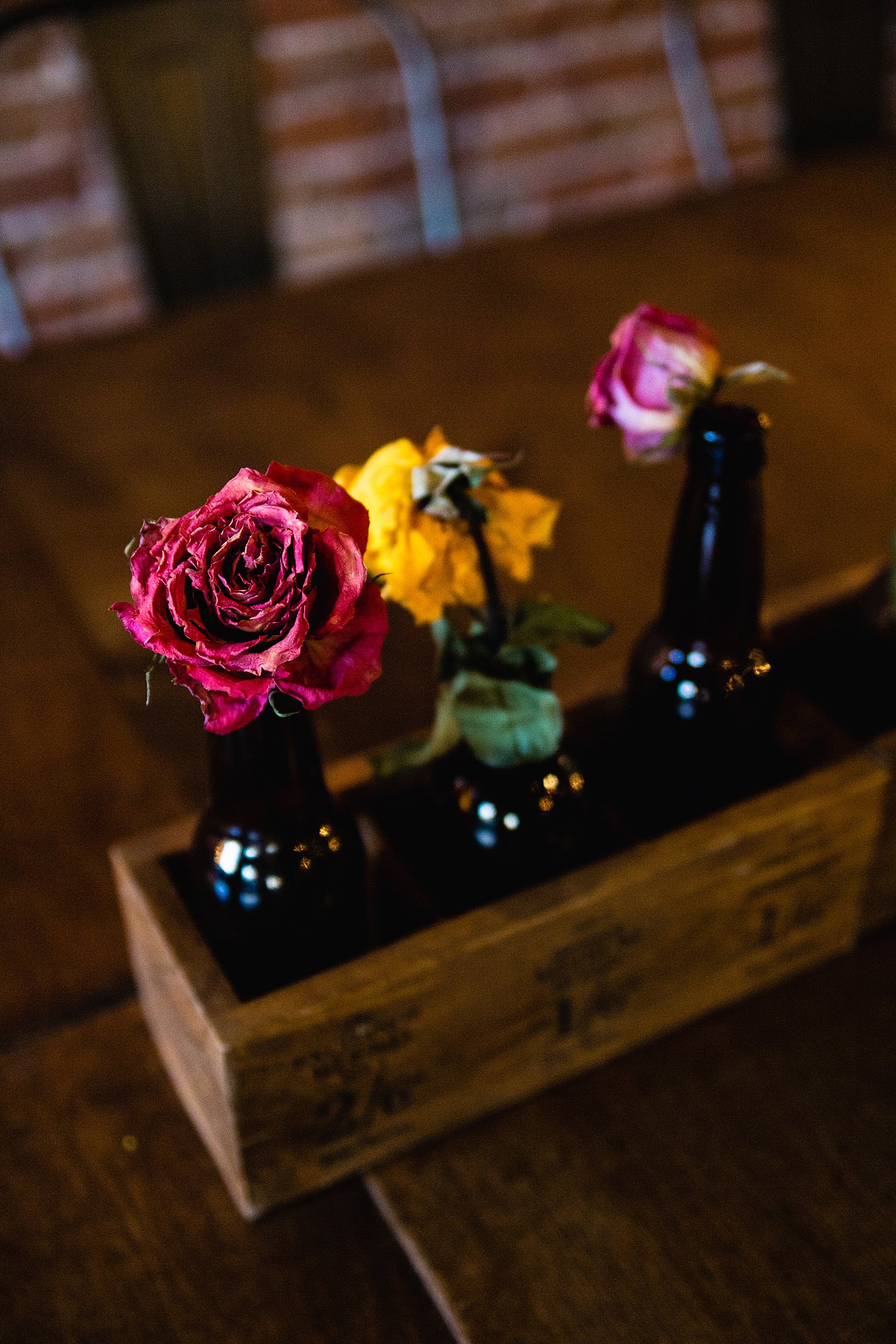 Dried roses in glass bottles at The Nile by Phoenix engagement photographers PMA Photography.