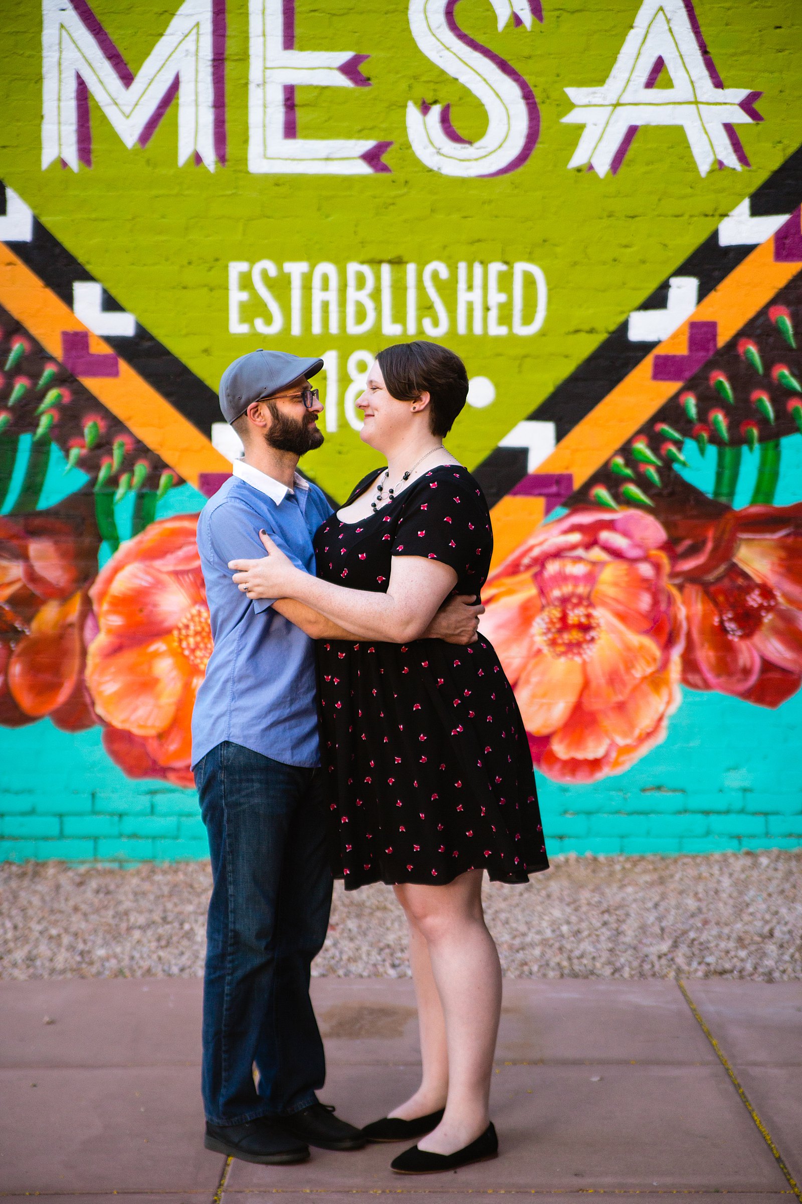 Couple pose for their Downtown Mesa engagement session by Phoenix wedding photographer PMA Photography.