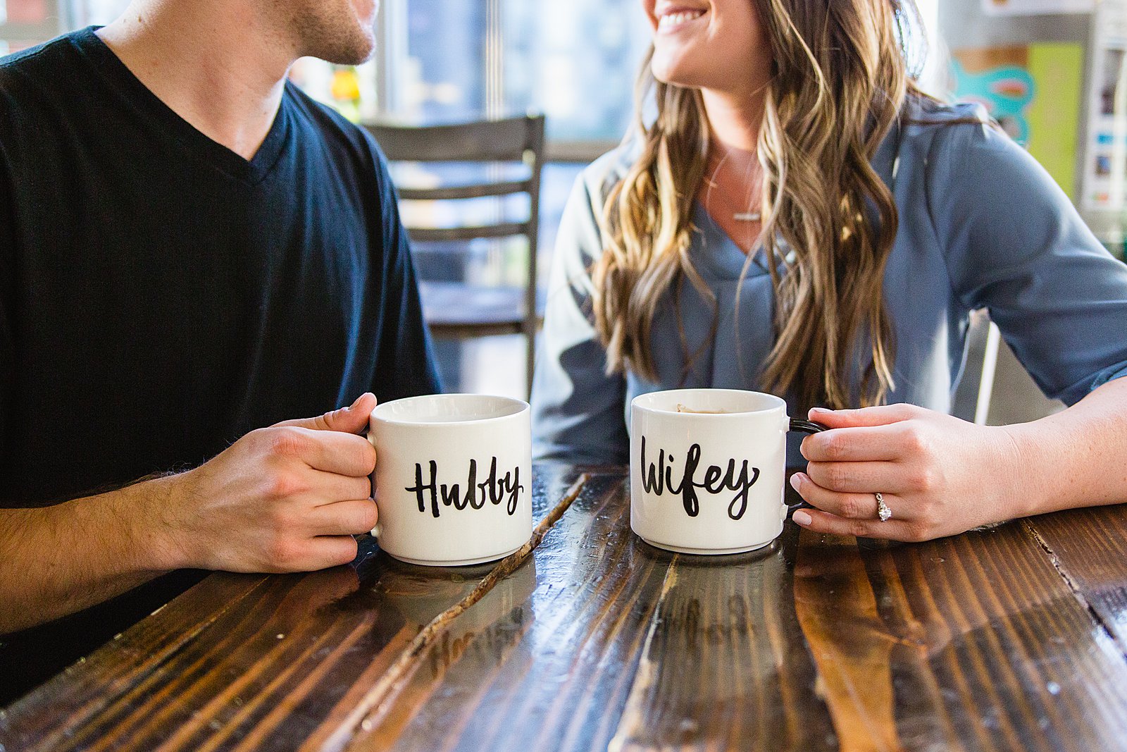 Couple's hubby and wifey matching coffee cups during their Jobot engagement session by PMA Photography