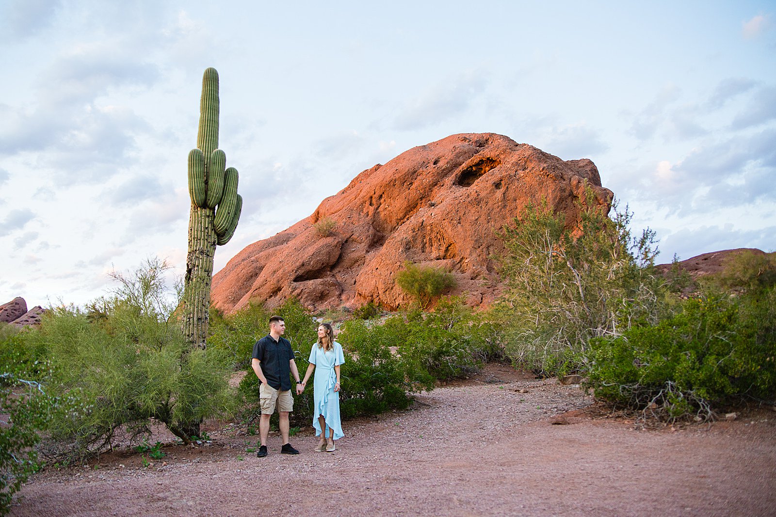 Couple pose for their Papago Park engagement session by Phoenix wedding photographer PMA Photography.