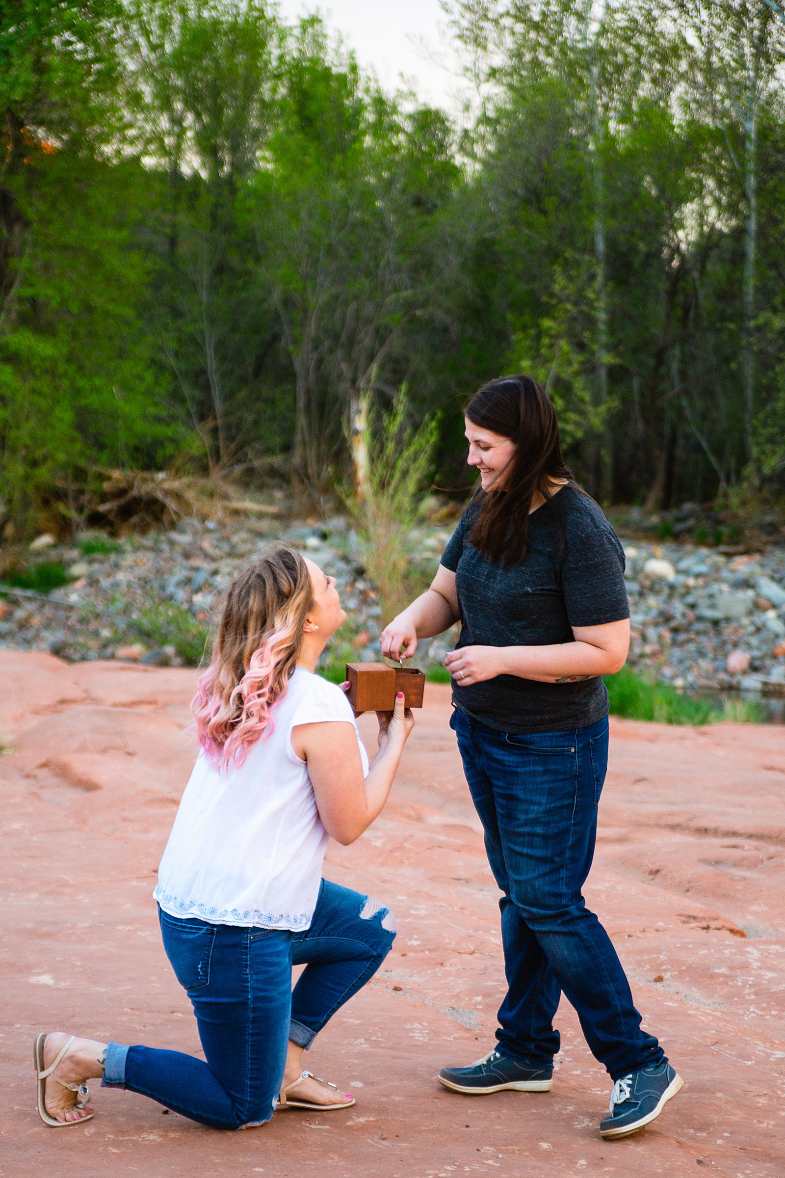 LGBTQ couple pose for their Crescent Moon Ranch engagement session by Sedona wedding photographer PMA Photography.
