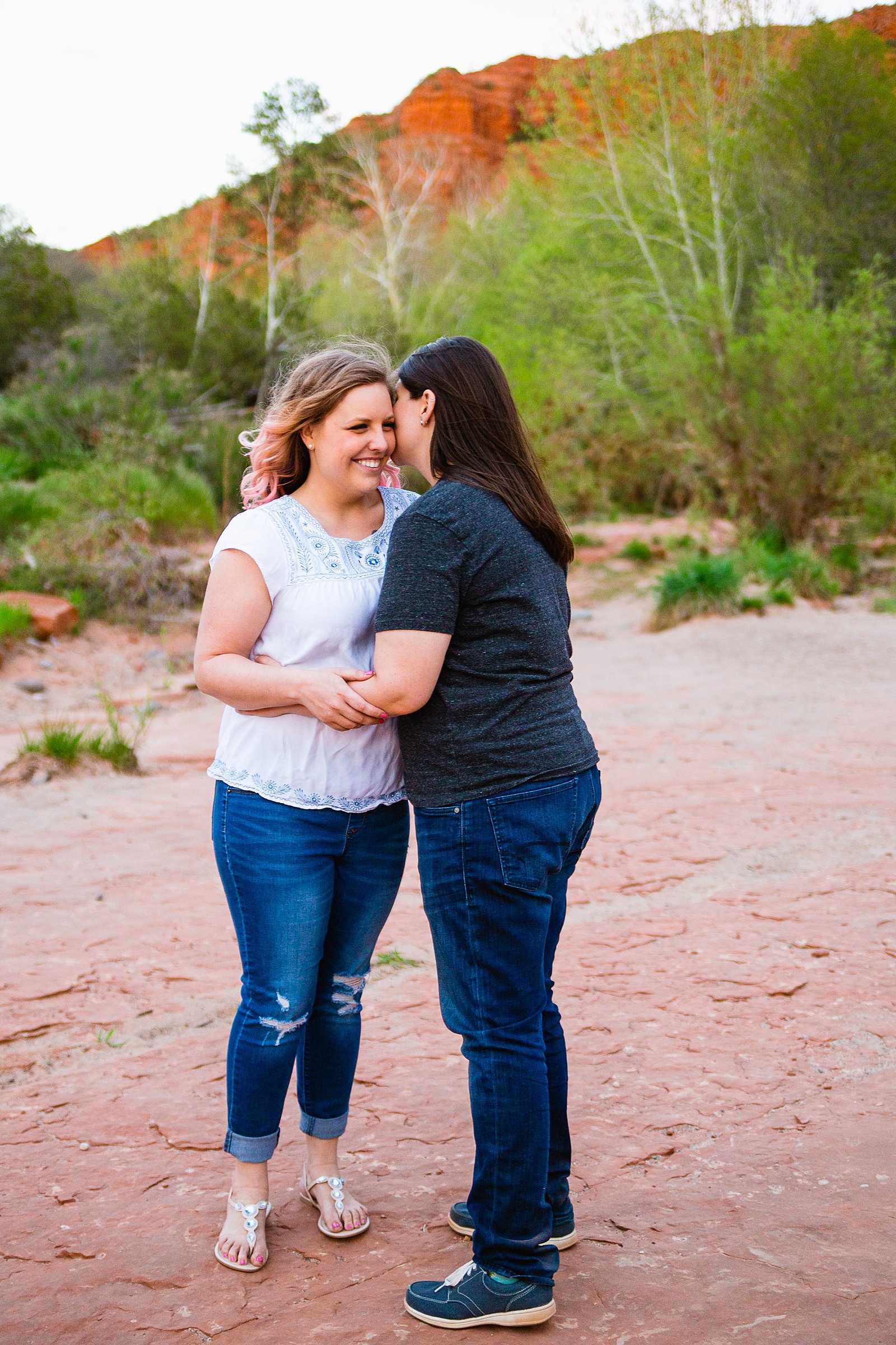 Same Sex couple share an intimate moment at their Sedona engagement session by Arizona engagement photographer PMA Photography.