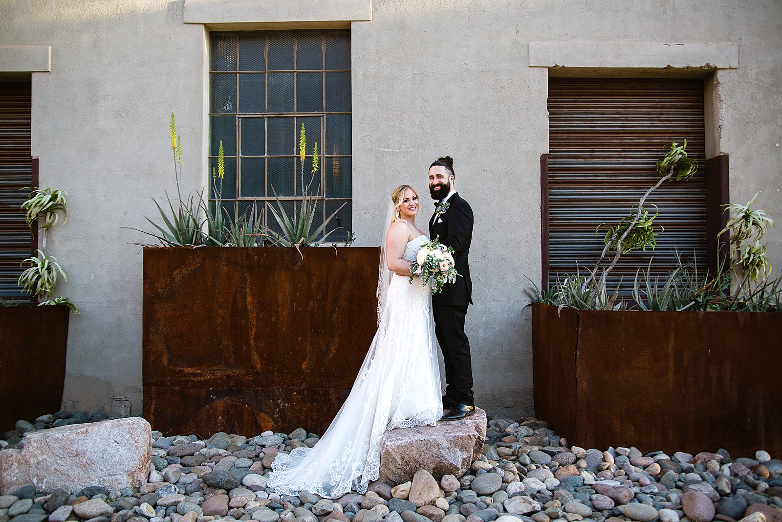 Bride and Groom pose during their The Ice House wedding by Arizona wedding photographer PMA Photography.