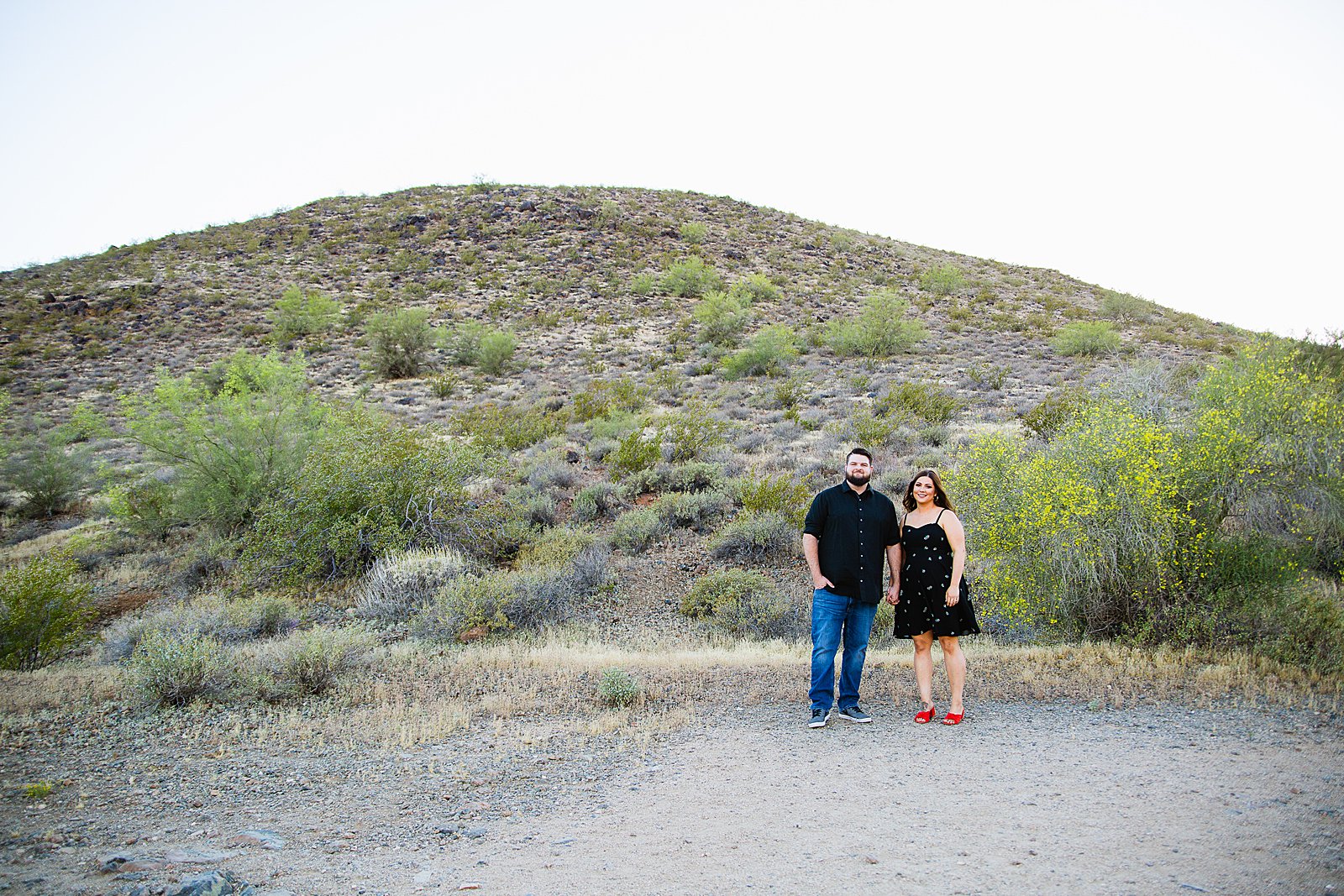 Couple pose for their Thunderbird Mountain engagement session by Phoenix wedding photographer PMA Photography.