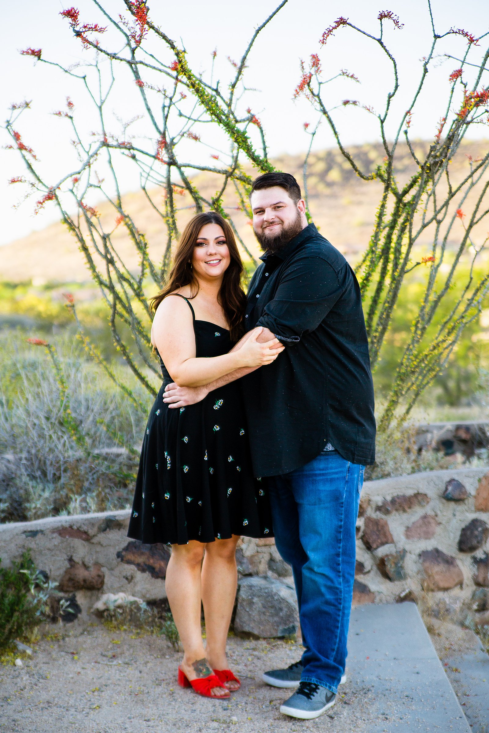 Couple pose for their Thunderbird Mountain engagement session by Phoenix wedding photographer PMA Photography.
