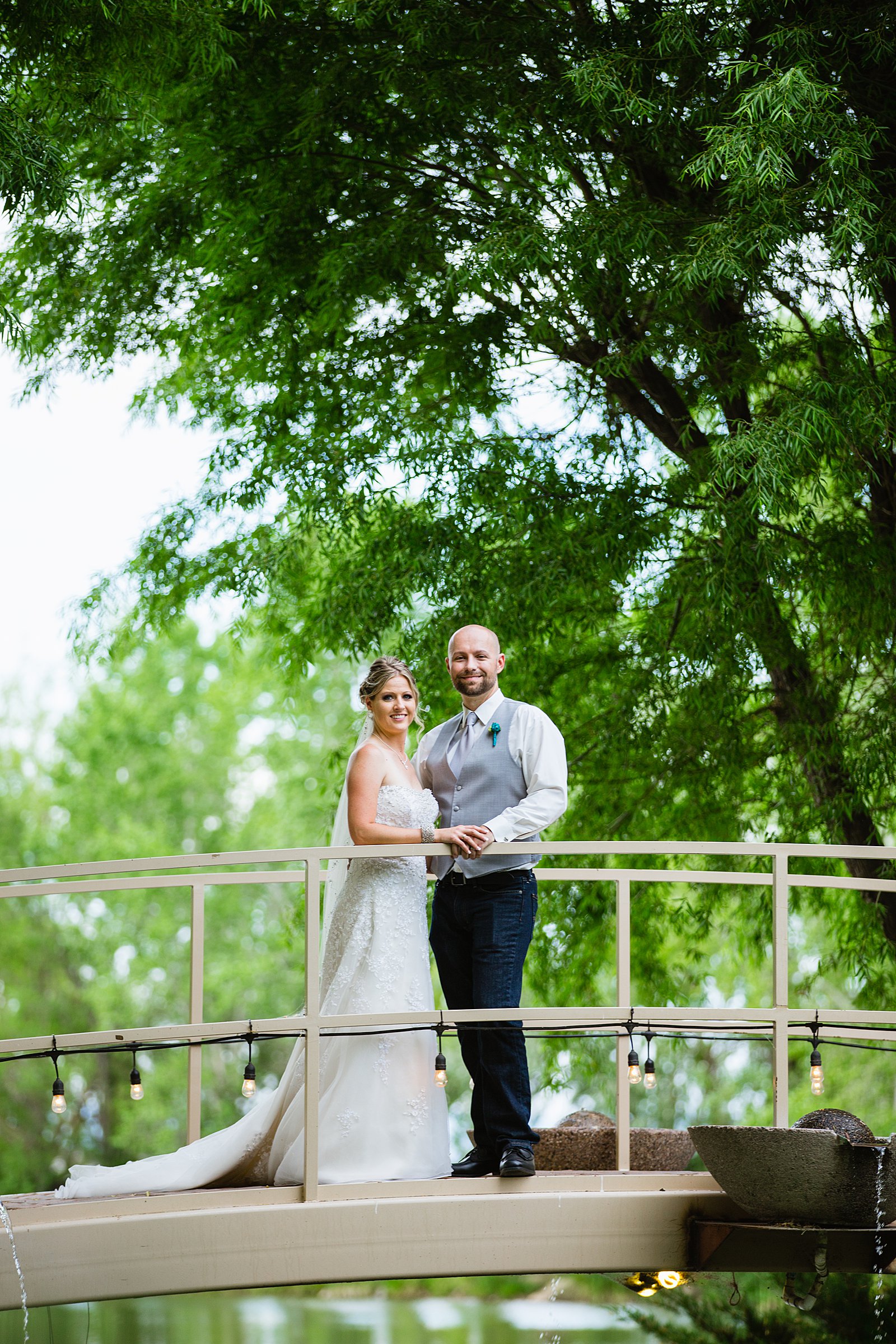 Bride and Groom pose during their The Windmill House wedding by Arizona wedding photographer PMA Photography.