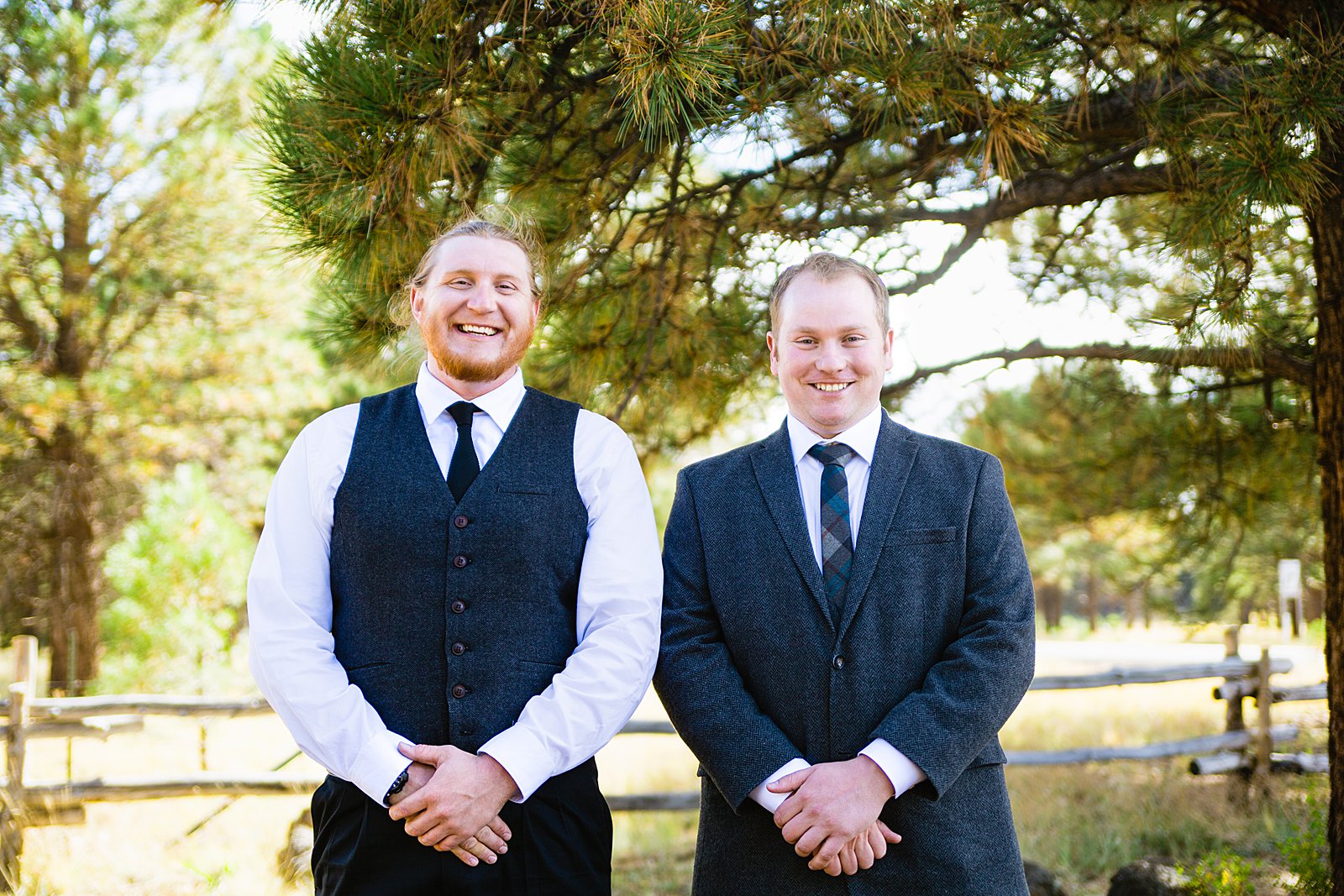 Groom and groomsmen laughing together at Chapel of the Holy Dove wedding by Flagstaff wedding photographer PMA Photography.