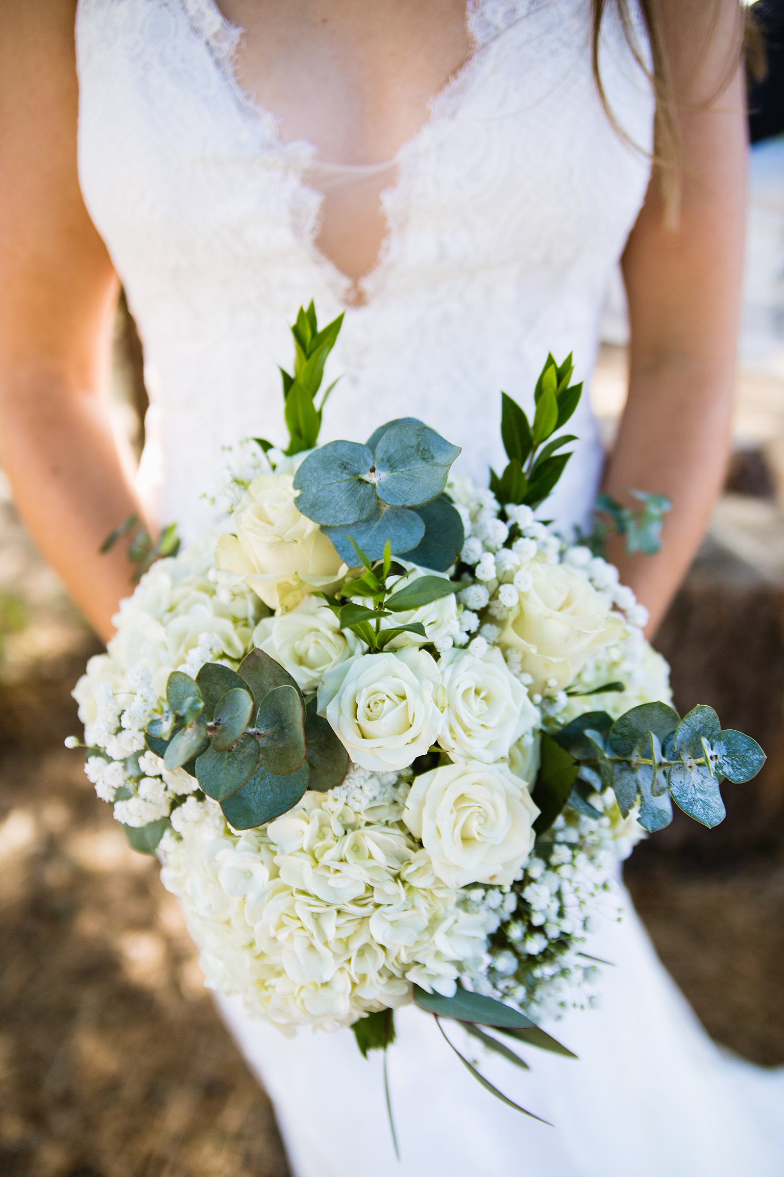 Bride's simple white and green DIY bouquet by PMA Photography.