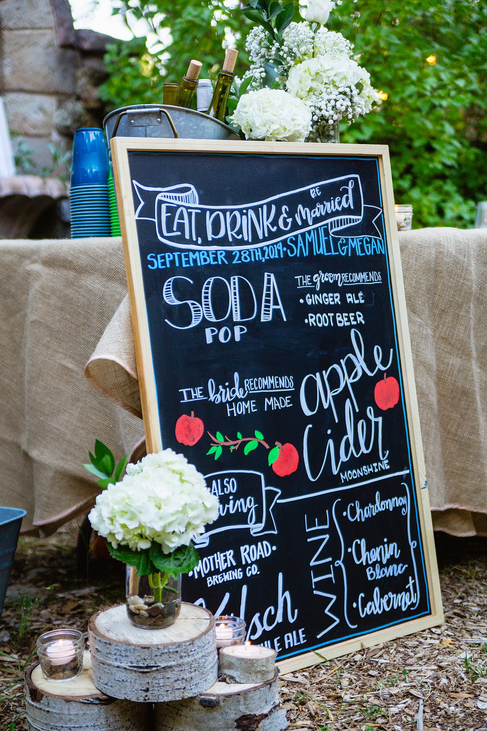 Custom drinks chalkboard sign at wedding reception by PMA Photography.