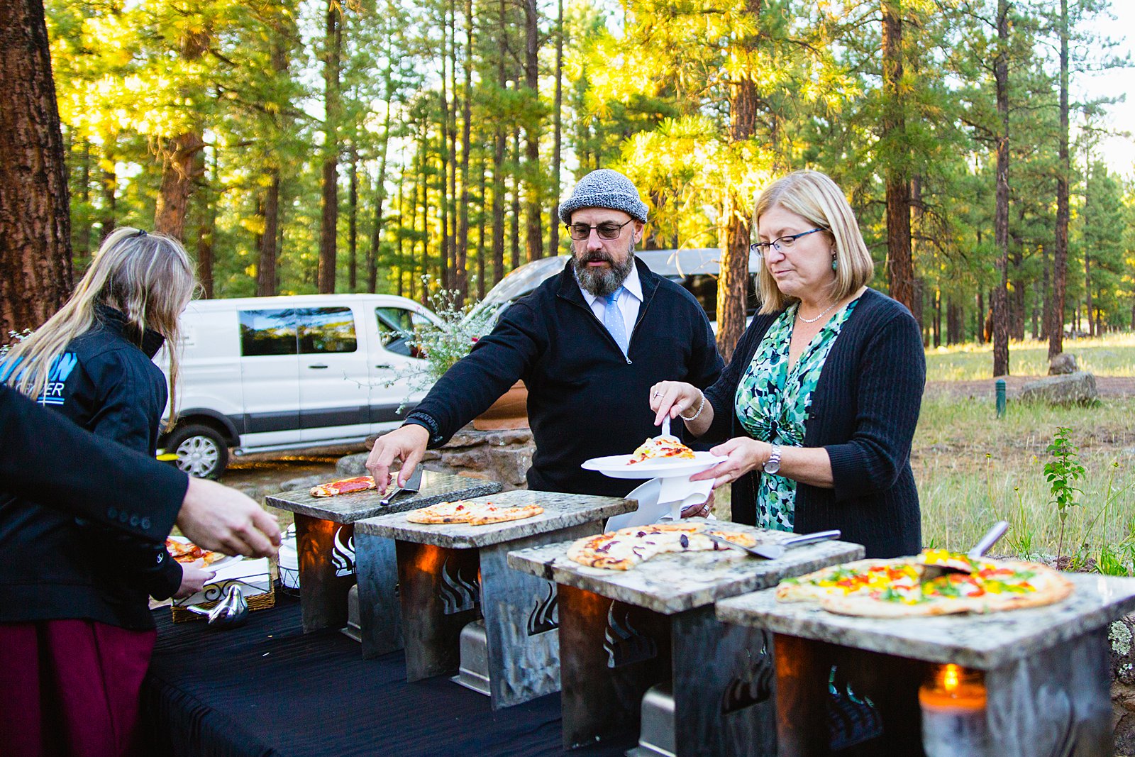 Into The Fire Pizza serving fresh pizza at a wedding reception at The Colton House in Flagstaff by PMA Photography.