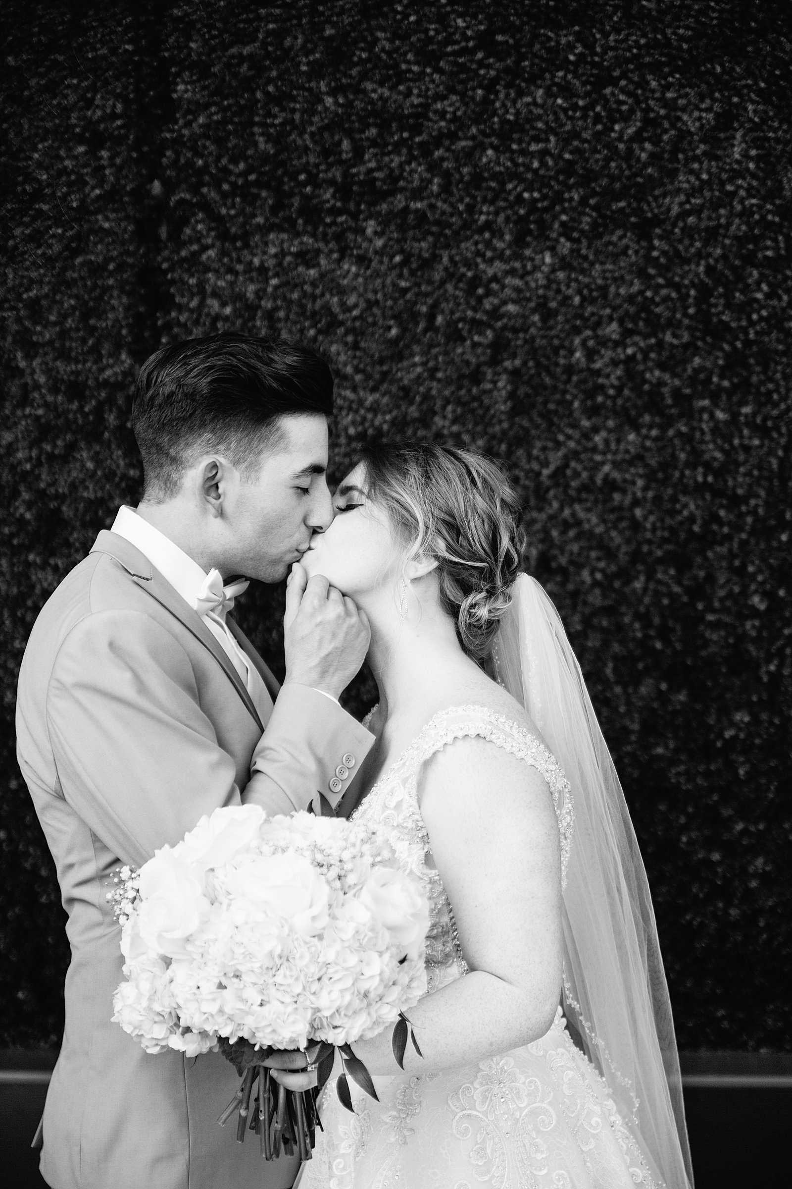Bride and Groom share an intimate moment during their SoHo63 wedding by Chandler wedding photographer PMA Photography.