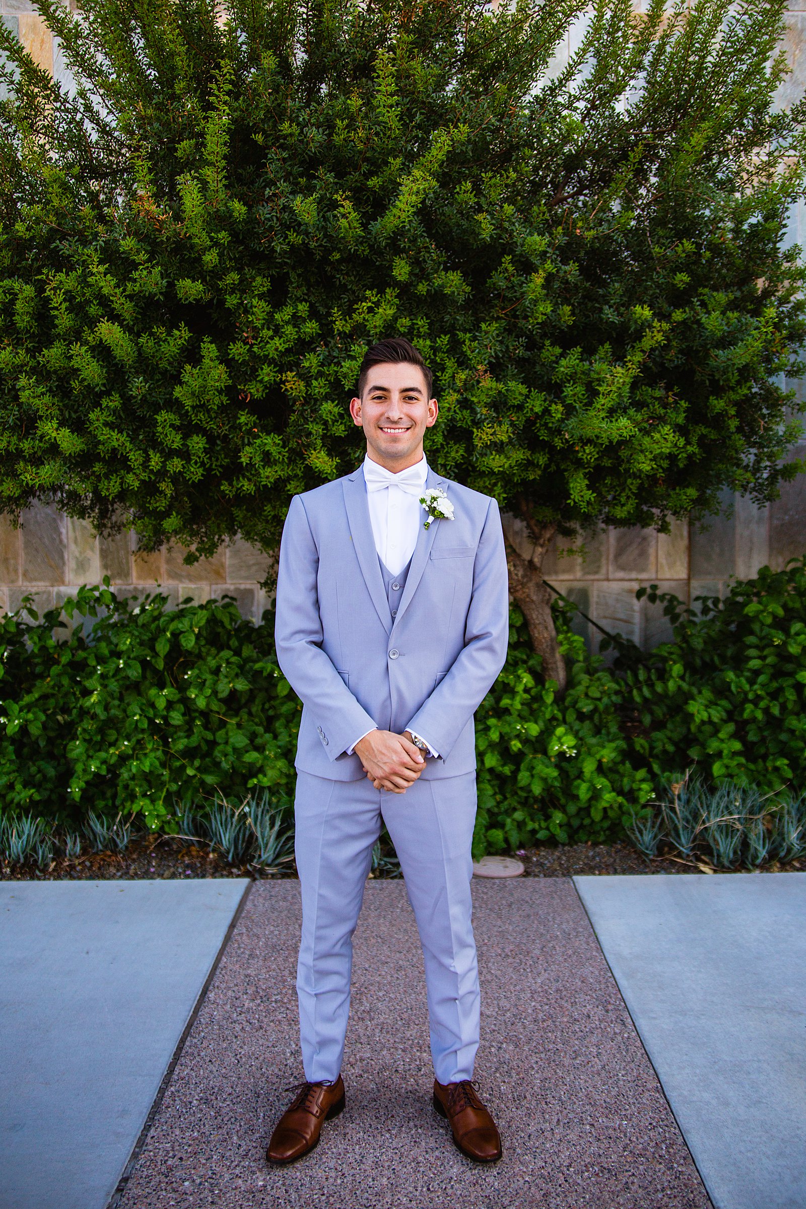 Groom's modern grey and white suit for his SoHo63 wedding by PMA Photography.