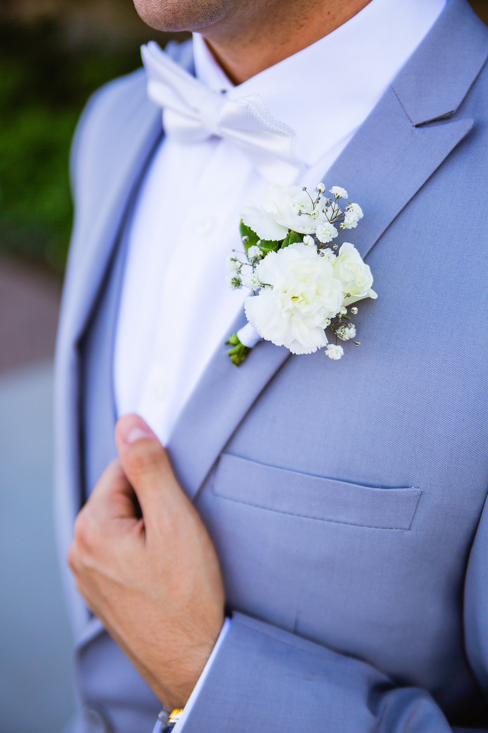 Groom's modern white boutonniere by PMA Photography.