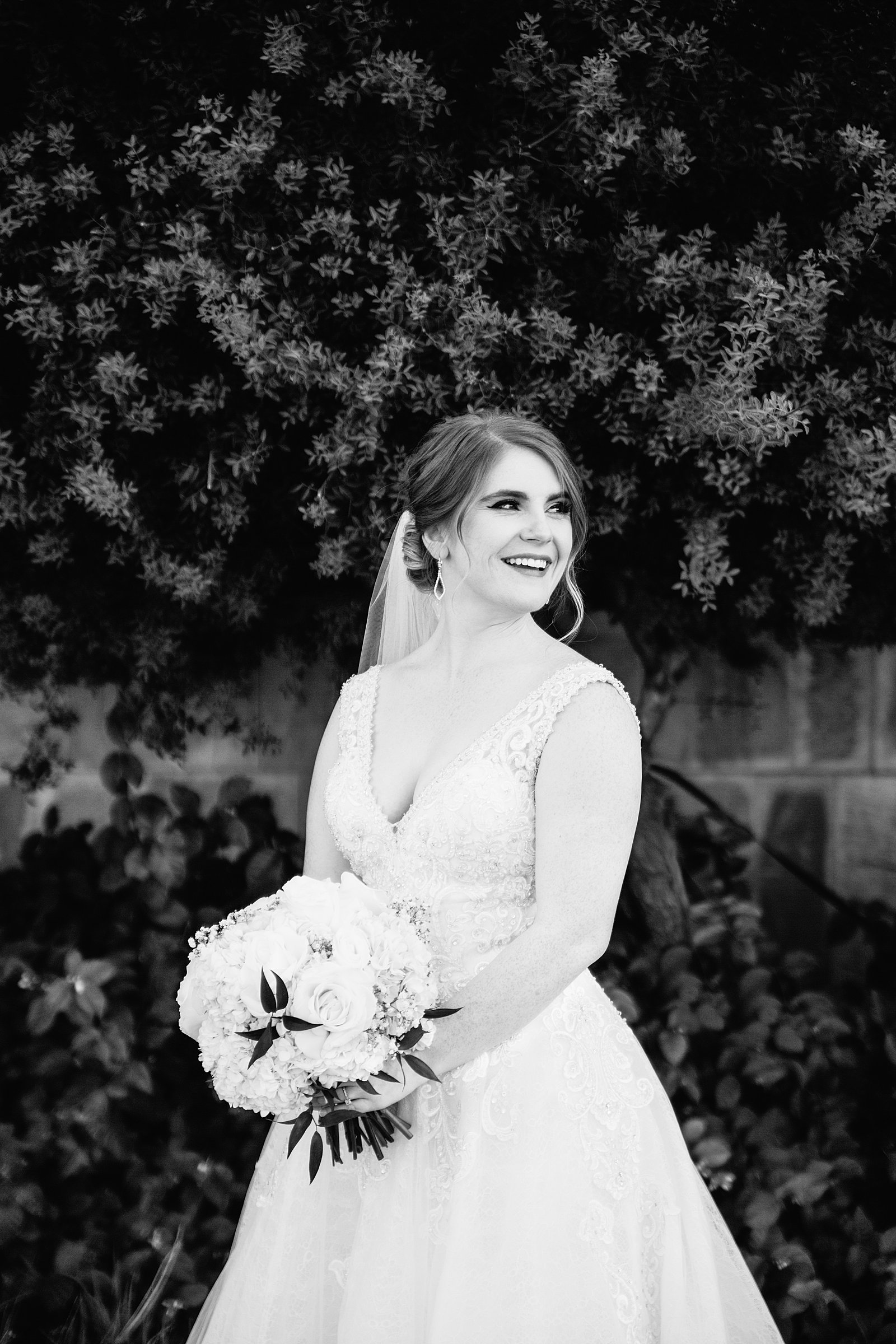 Bride laughing on her wedding day by Phoenix wedding photographer PMA Photography.