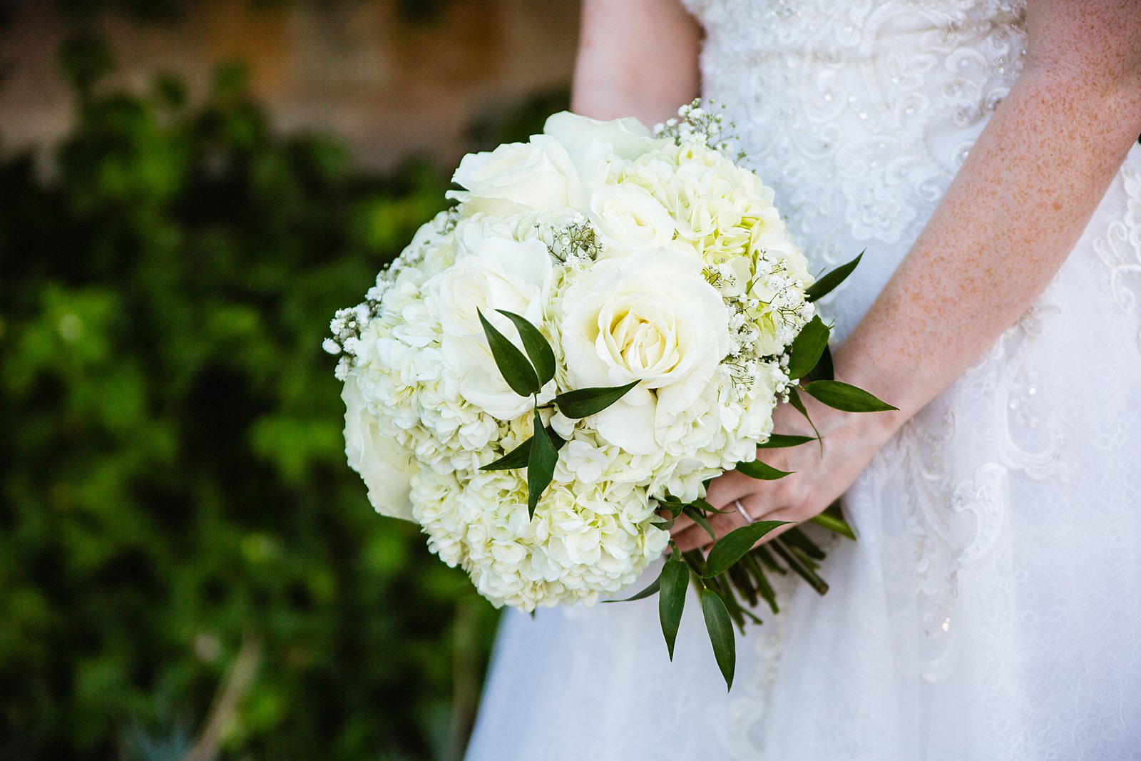 Bride's modern white bouquet by PMA Photography.