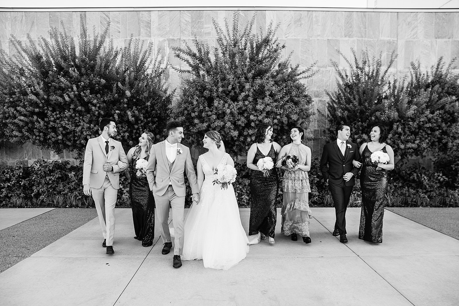 Mixed gender party having fun together at SoHo63 weding by Arizona wedding photographer PMA Photography.