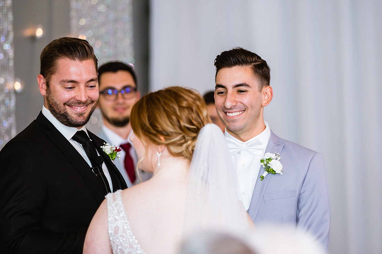 Groom looking at his bride during their wedding ceremony at SoHo63 by Chandler wedding photographer PMA Photography.