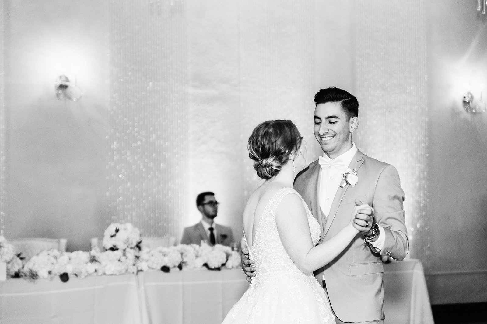 Bride and Groom sharing first dance at their SoHo63 wedding reception by Arizona wedding photographer PMA Photography.