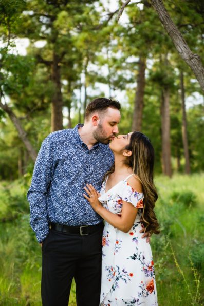 Couple share a kiss during their Payson engagement session by Arizona wedding photographer PMA Photography.